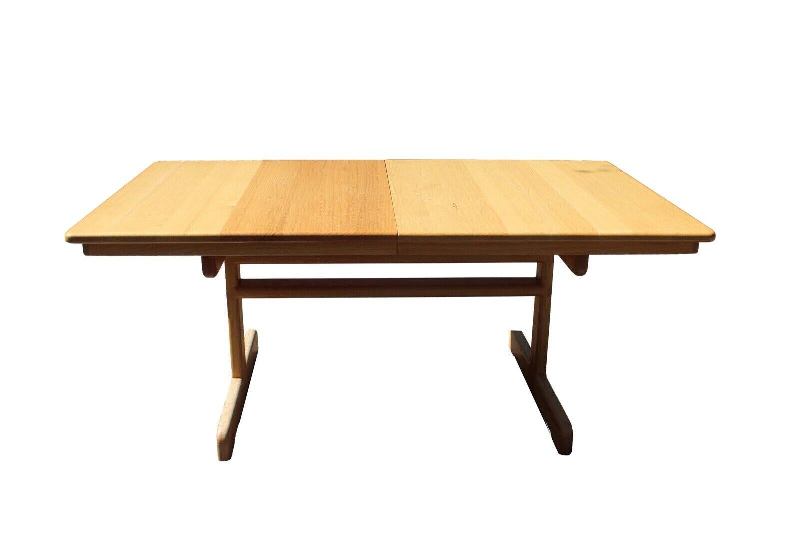 We presents this truly exceptionally handmade expandable dining table from Douglas Lambect, Jerry Mandell and Associates from Bloomington, Indiana. In excellent condition. Has 3 leafs. Dimensions: table: 71