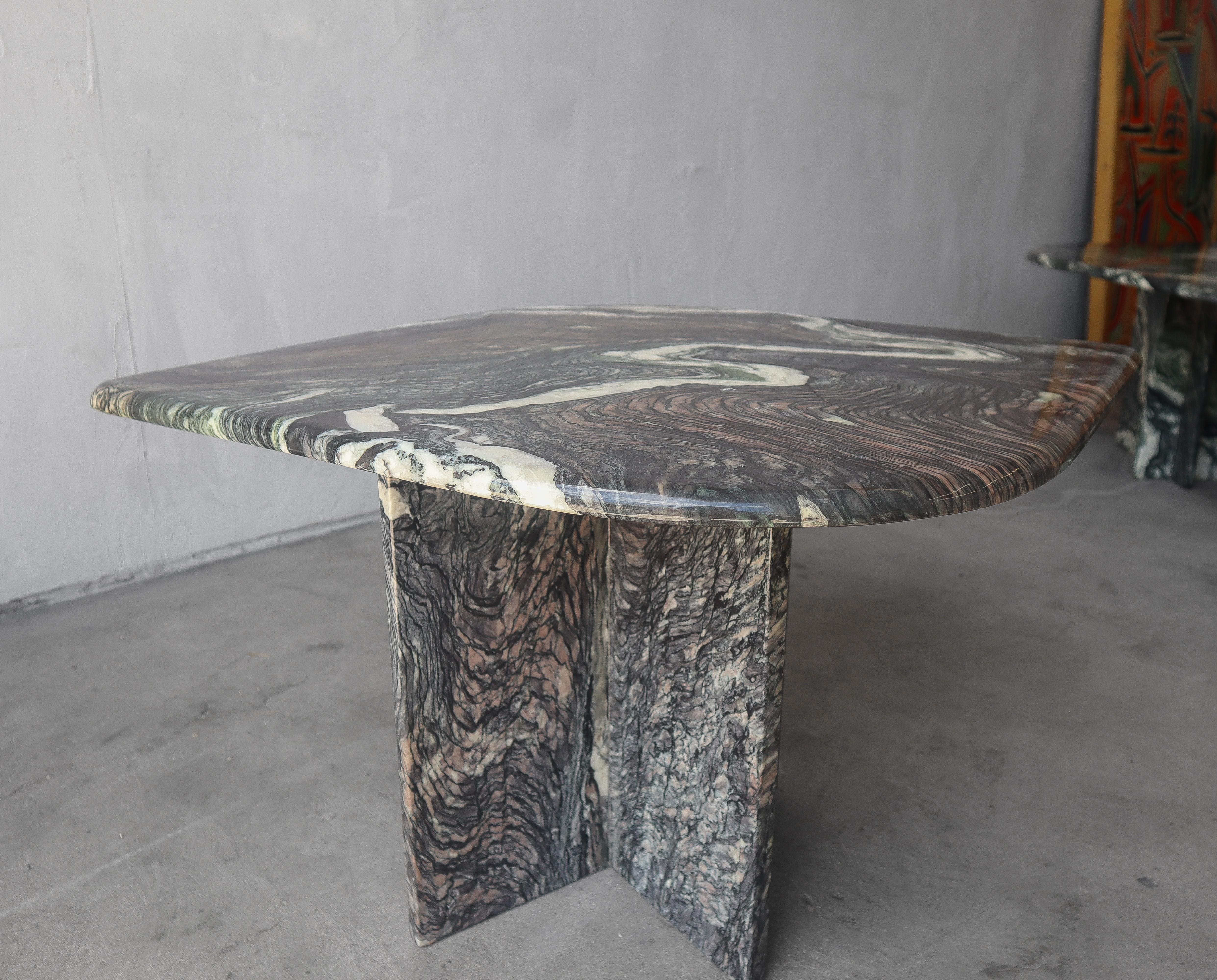 Beautiful Post Modern, swirled marble side table on a t-shape pedestal base. 

Table is in excellent condition with minimal wear to the finish from age and use. There is one small chip in the finish, see last image other than that there are no chips