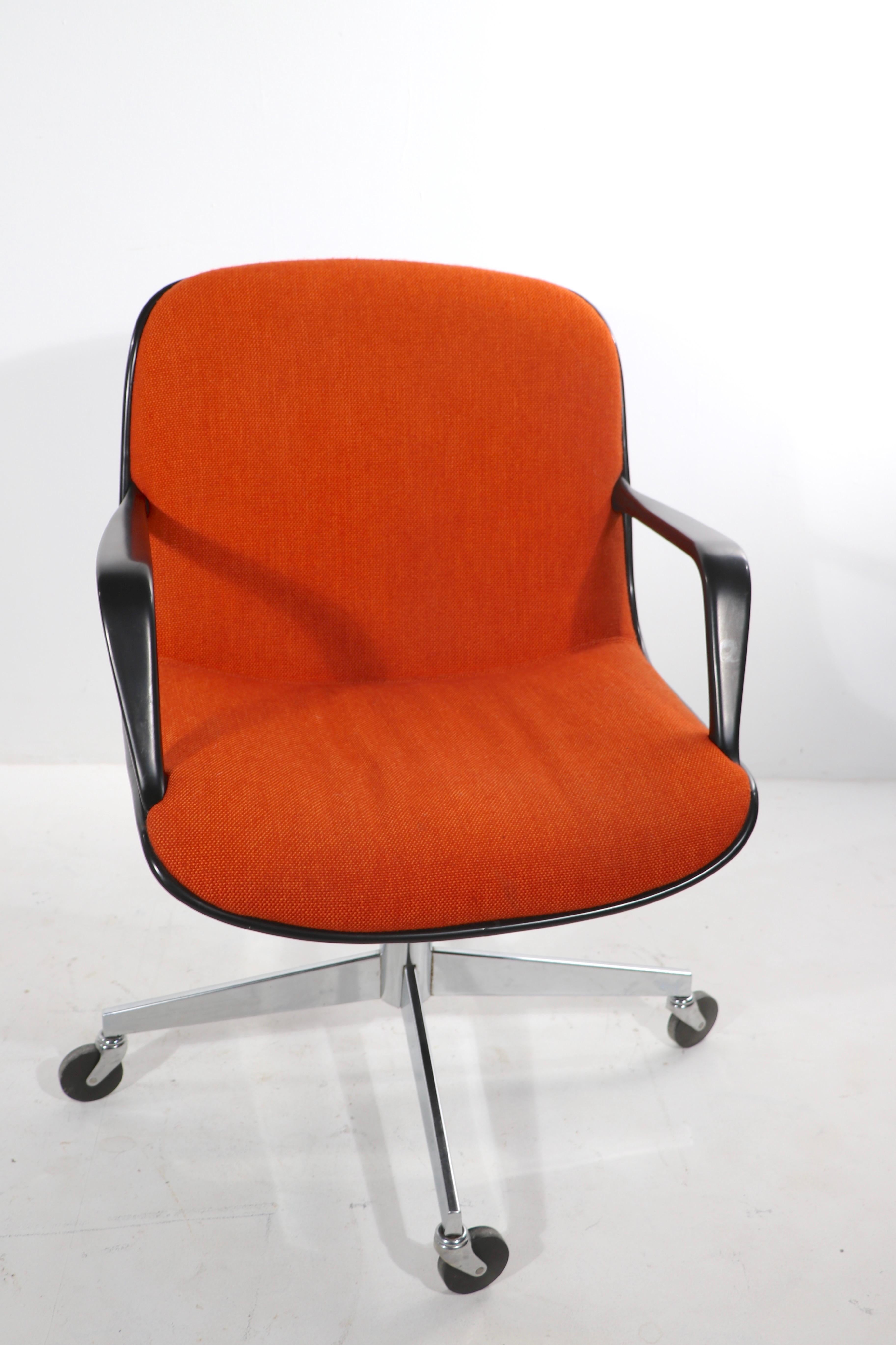 Exceptional Steelcase swivel, tilt, office or desk chair (s) having classic orange tweed fabric upholstered seats and backs, on dark gray exterior shells, black arms, chrome pedestal, and legs, with wheel caster feet. These chairs are not only