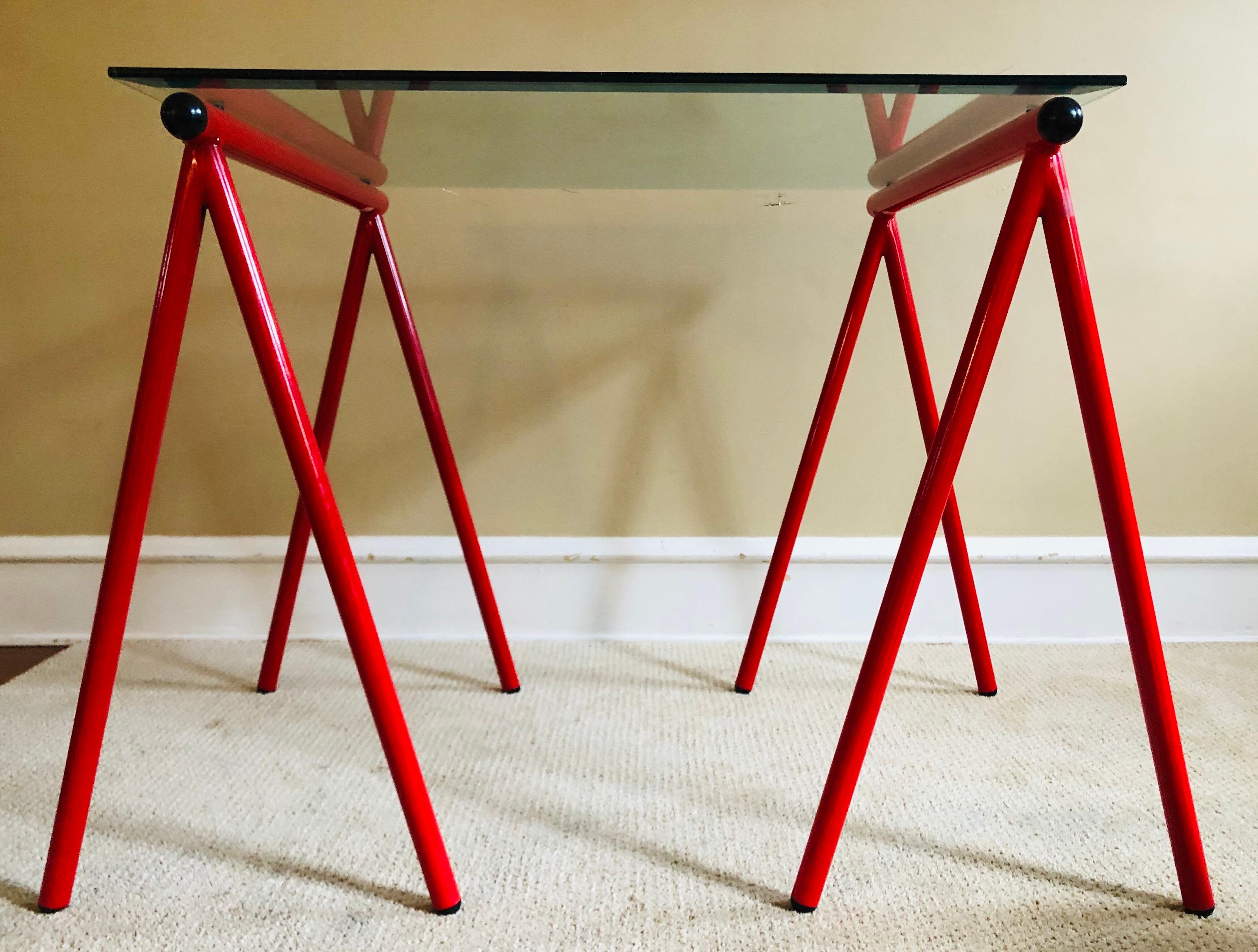 Postmodern Amisco sawhorse desk or table base in red and black. Amisco tags affixed to both bases. Glass is not included, easy to source on your end.