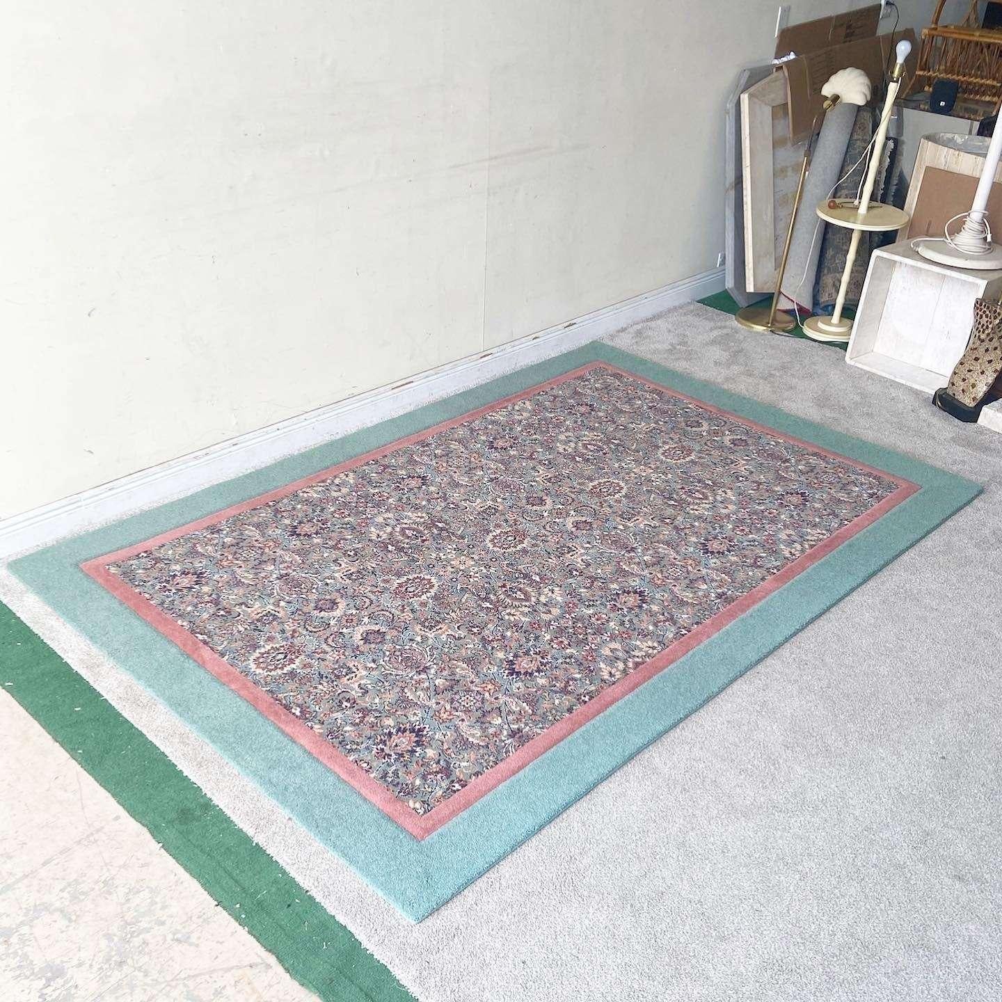 Fantastic vintage postmodern rectangular area rug. Features a traditional eastern design within a pink and teal edge.,

Rug 33
