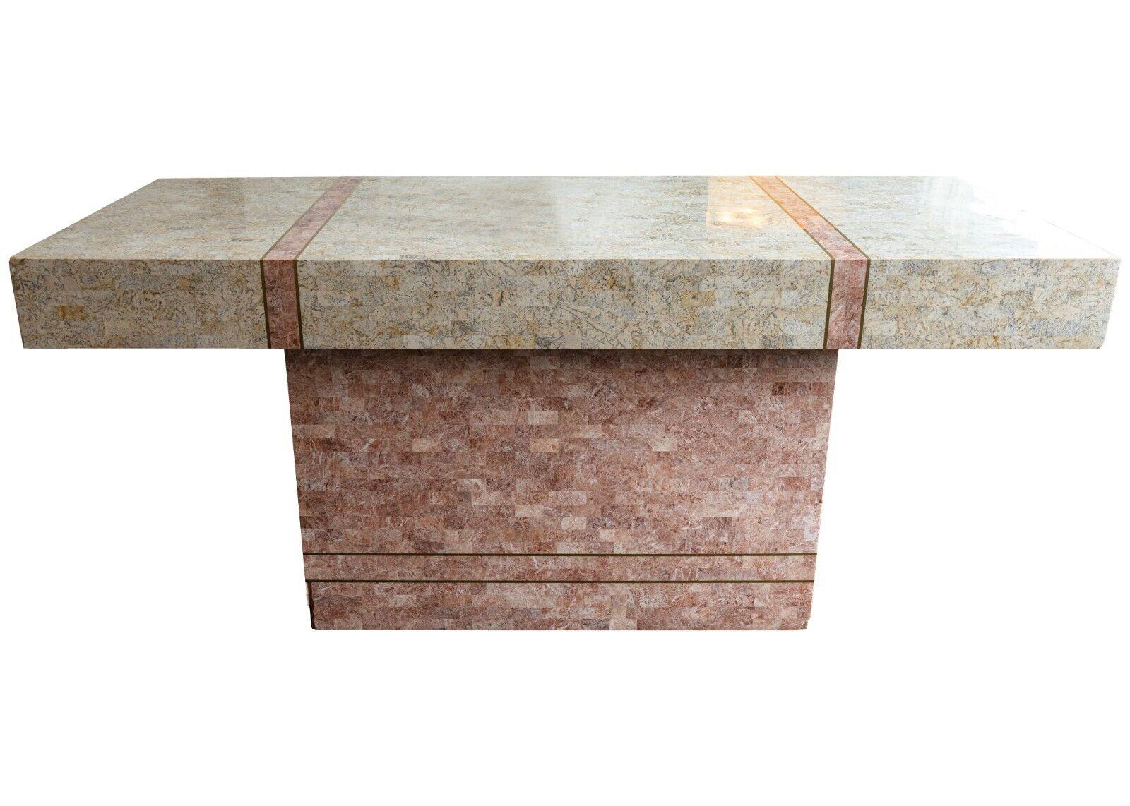 A 1970s Post Modern tessellated stone tile and brass executive desk by Robert Marcius for Maitland Smith. This marvelous piece is constructed with a hardwood inner frame surrounded by gorgeous pink tessellated stone tiles on the base, and white and