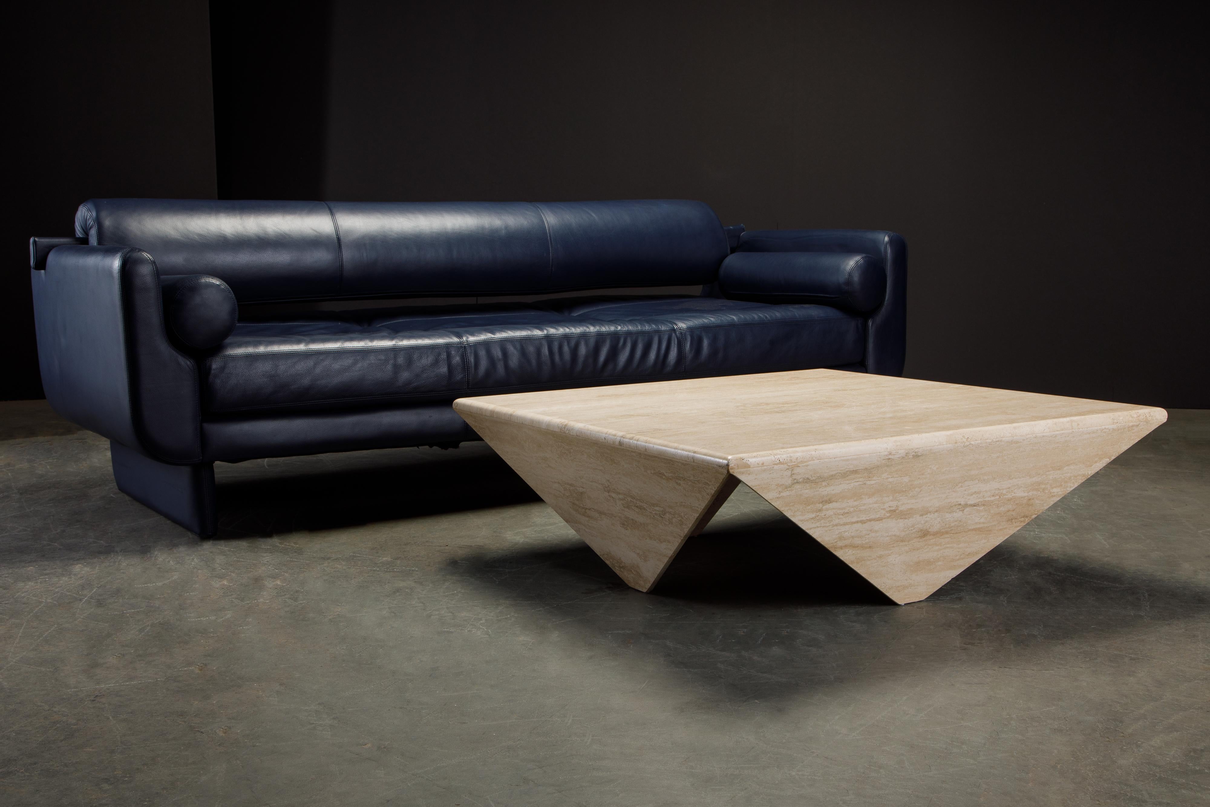 Such a unique design, this travertine coffee table features four triangular legs which were made to look like the travertine folds over into the legs, similar to the Brazilian Modern 'Petalas' table by Jorge Zalszupin. 

Travertine tables are