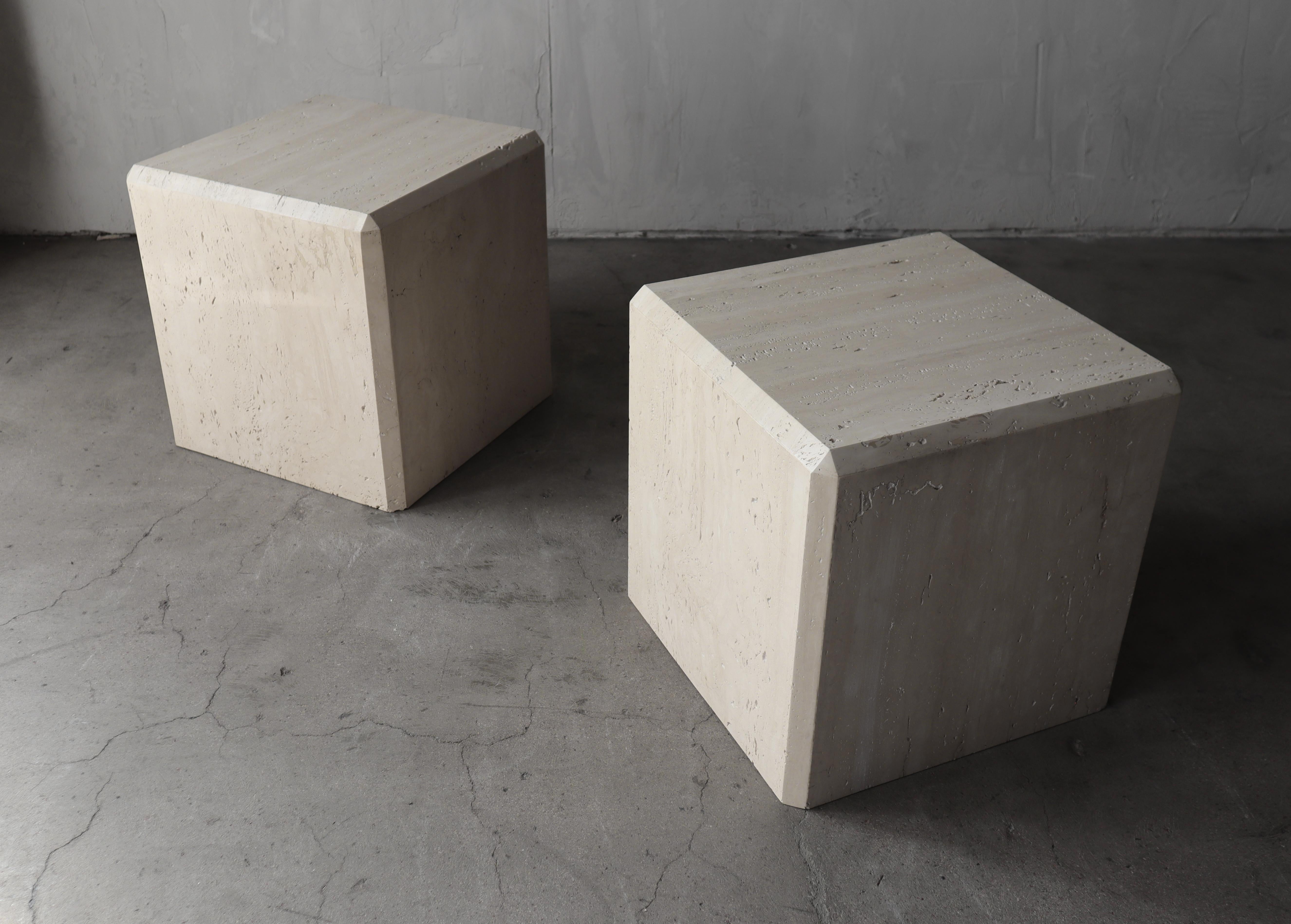 Clean pair of polished travertine cubes by Kreiss Furniture. Simple, clean and versatile. Use as side tables, end tables or side by side as a small coffee table. 
 They could even be used as stools or low art pedestals, basically any way you