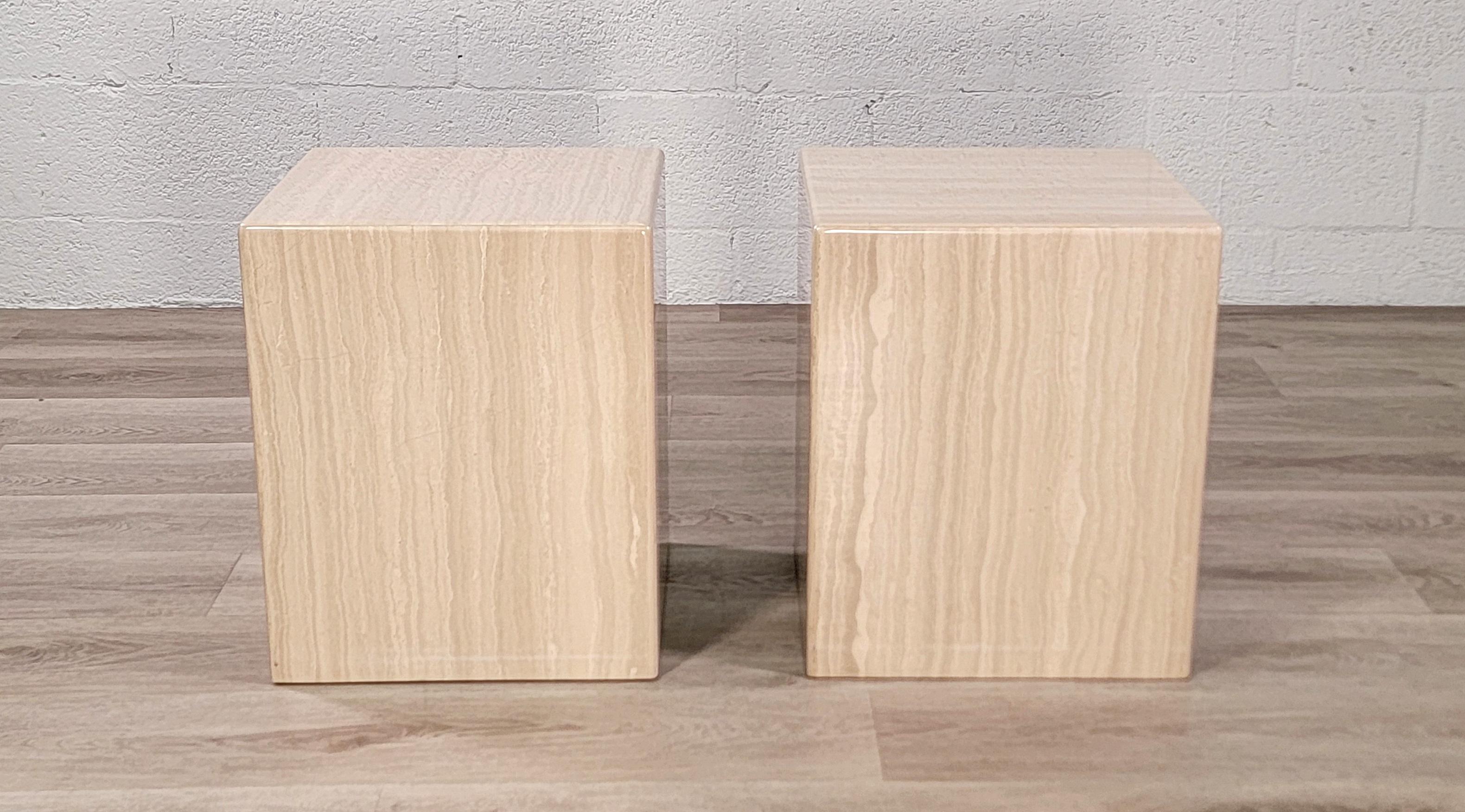 Clean pair of Italian polished travertine cubes from circa late 1970s to early 1980s. Simple, neutral and versatile. Use as side tables, end tables or side by side as a small coffee table. 

They could even be used as stools or low art pedestals,