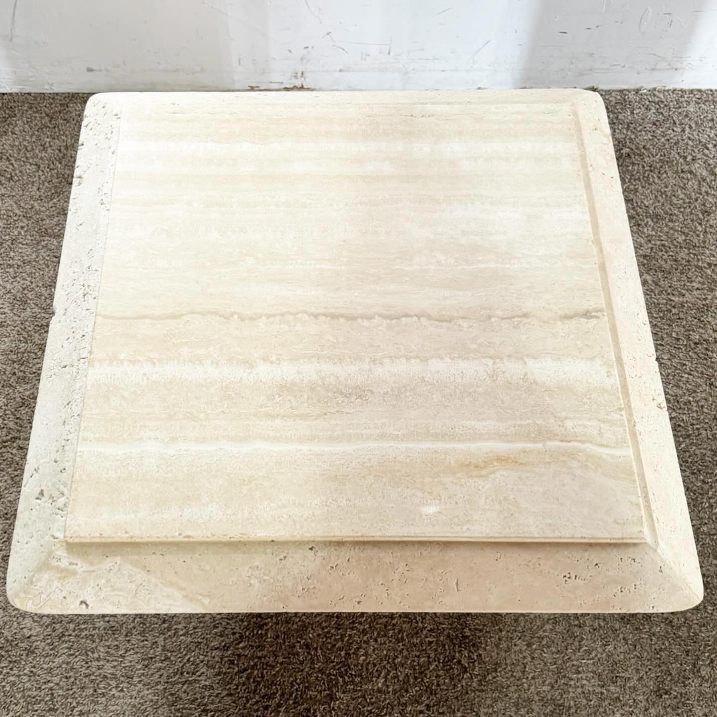 Add a touch of timeless elegance to your living space with the Post-Modern Travertine Square Beveled Top Side Tables - a Pair. These tables are beautifully crafted from natural travertine, showcasing unique patterns and colors. Each table features a