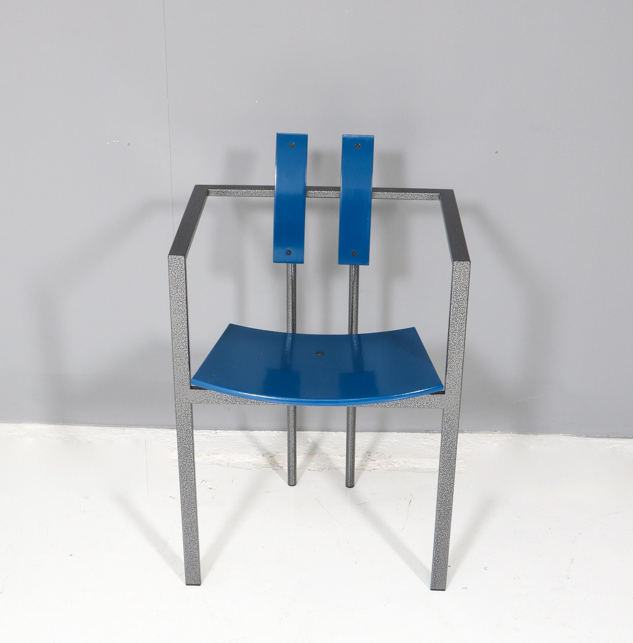 Stunning and rare Post-Modern Trix armchair.
Design by Karl Friedrich Förster for KFF.
Striking German design in the style of Memphis from the 1980s.
Original patinated steel frame with blue lacquered plywood armrests and backrests.
Rare, because of