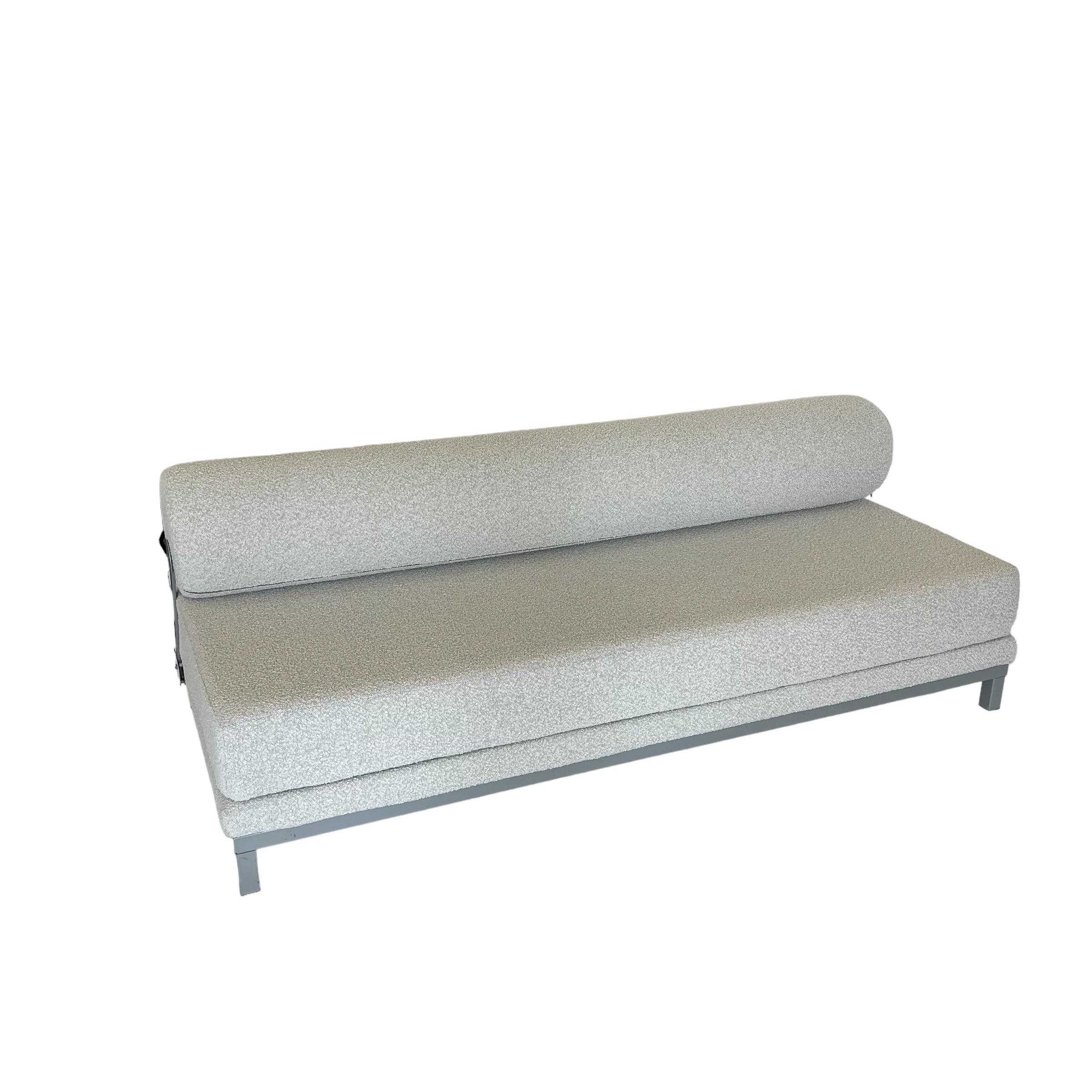 Postmodern versatile convertible sleeper sofa or daybed, rendered in a grey powder coated aluminum frame with adjustable tubular cylinder back rest allowing for different seat depths, and a convertible mattress seat cushion that can either be used