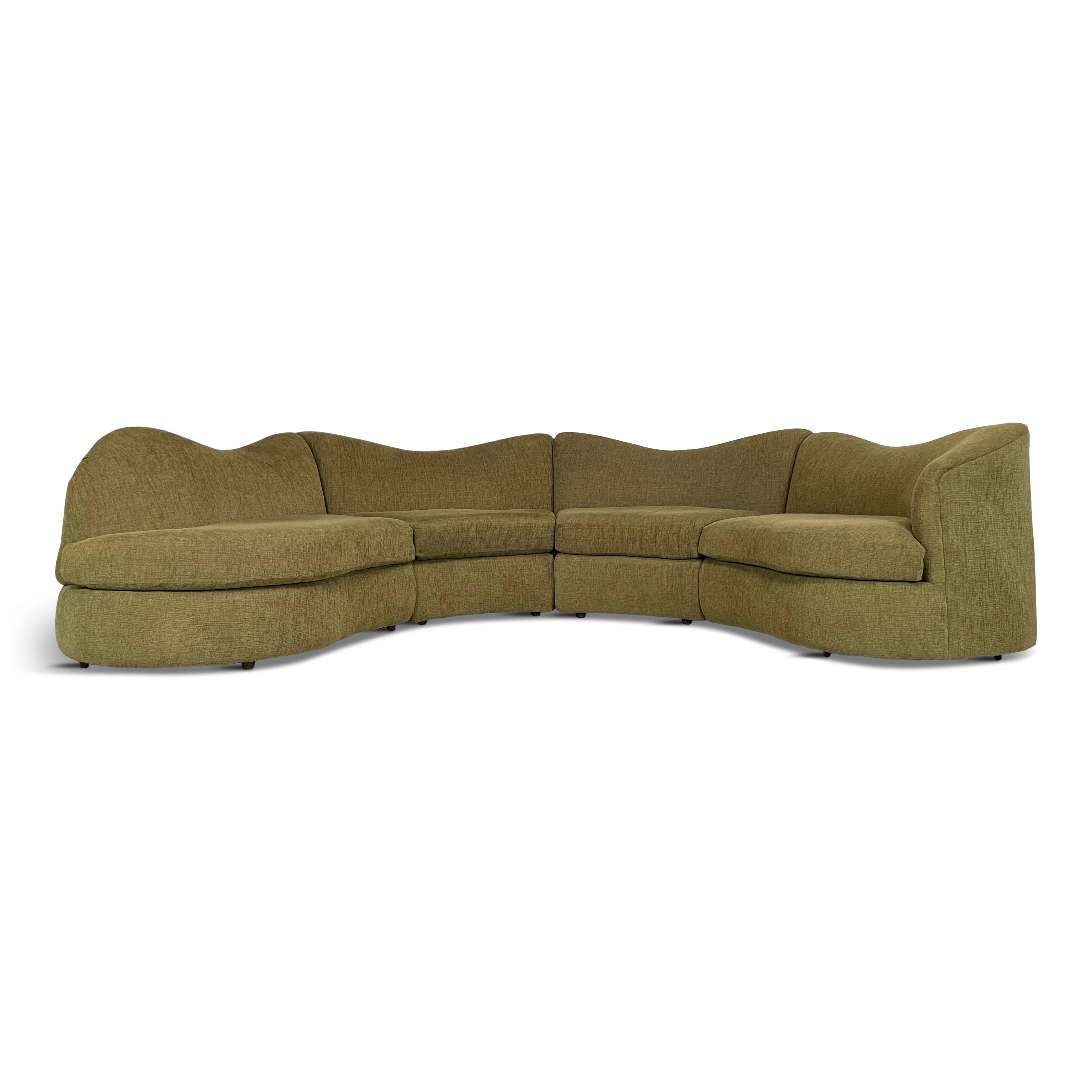 This four piece sectional sofa has incredible design lines from the 1990's. The fabric is dated and needs recovering. Foam and padding are excellent.
