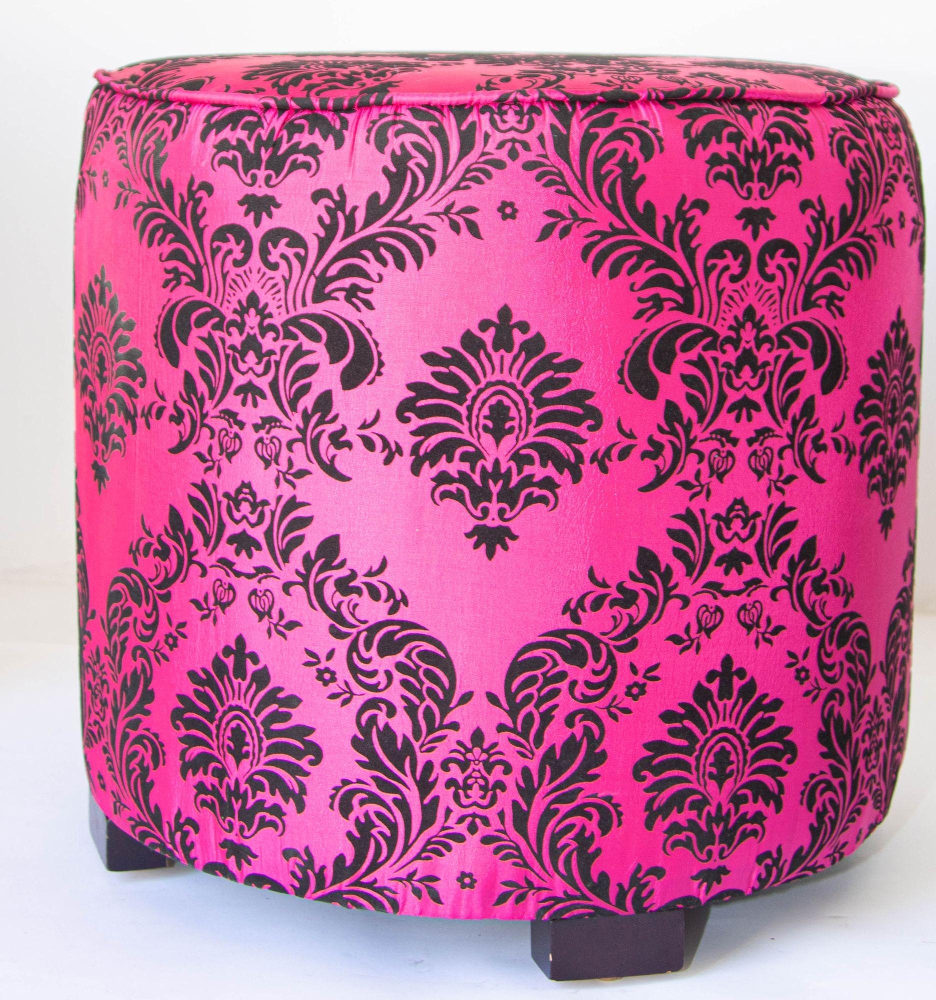 Art Deco Style fuchsia and black Moroccan stool, round ottoman or vanity stool in hot fuchsia color with black velvet cut design. 
The upholstery is a damask fabric in floral taffeta with a raised velvet printed texture. 
Pair of modern contemporary