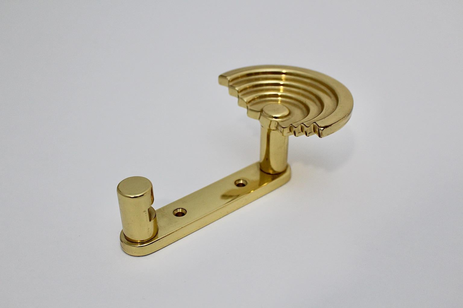 Post Modern vintage coat hook from brass by Ettore Sottsass SE 314 for Valli & Valli circa 1985 Italy.
A great coat hook from polished brass from the Post Modern period designed by Ettore Sottsass for Valli & Valli circa 1985 Italy.
This coat hook