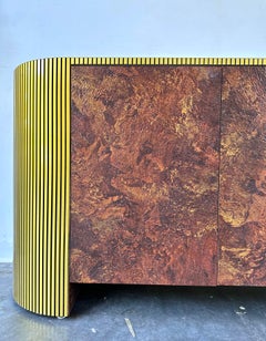 Post modern vintage faux Olive Burl and brass pill shape credenza