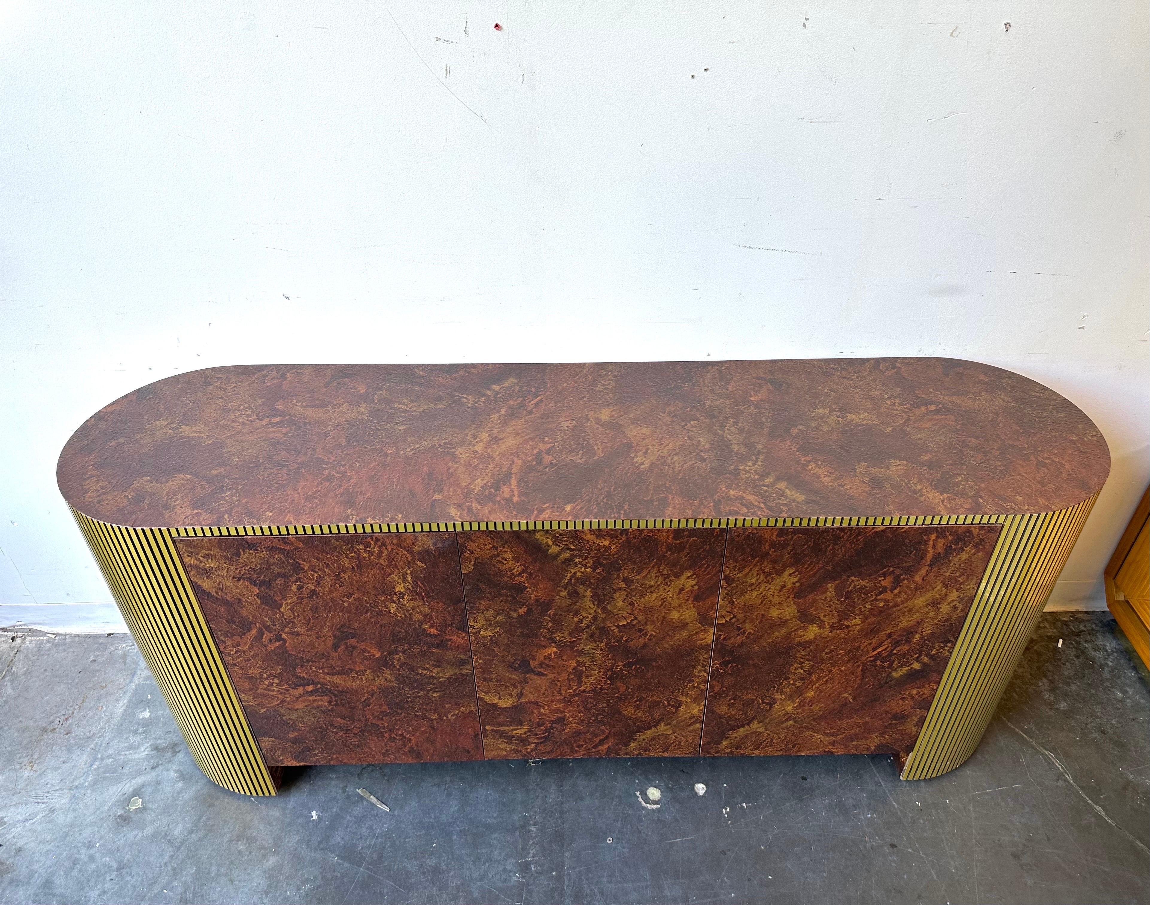 Woodwork Post modern vintage faux Olive Burl and brass pill shape credenza  For Sale