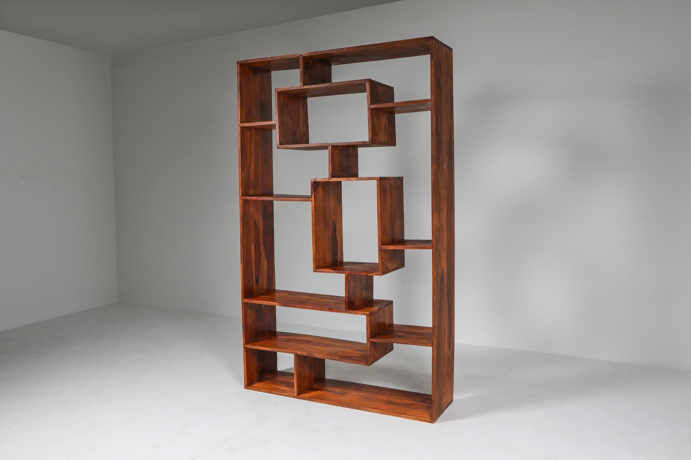Walnut shelves or book case made by an Italian Postmodern designer.
Breaking through the Minimalist modernism and emphasizing the amazing vein structures of the walnut, which almost resembles olive wood, this piece is the ideal mix of fun,