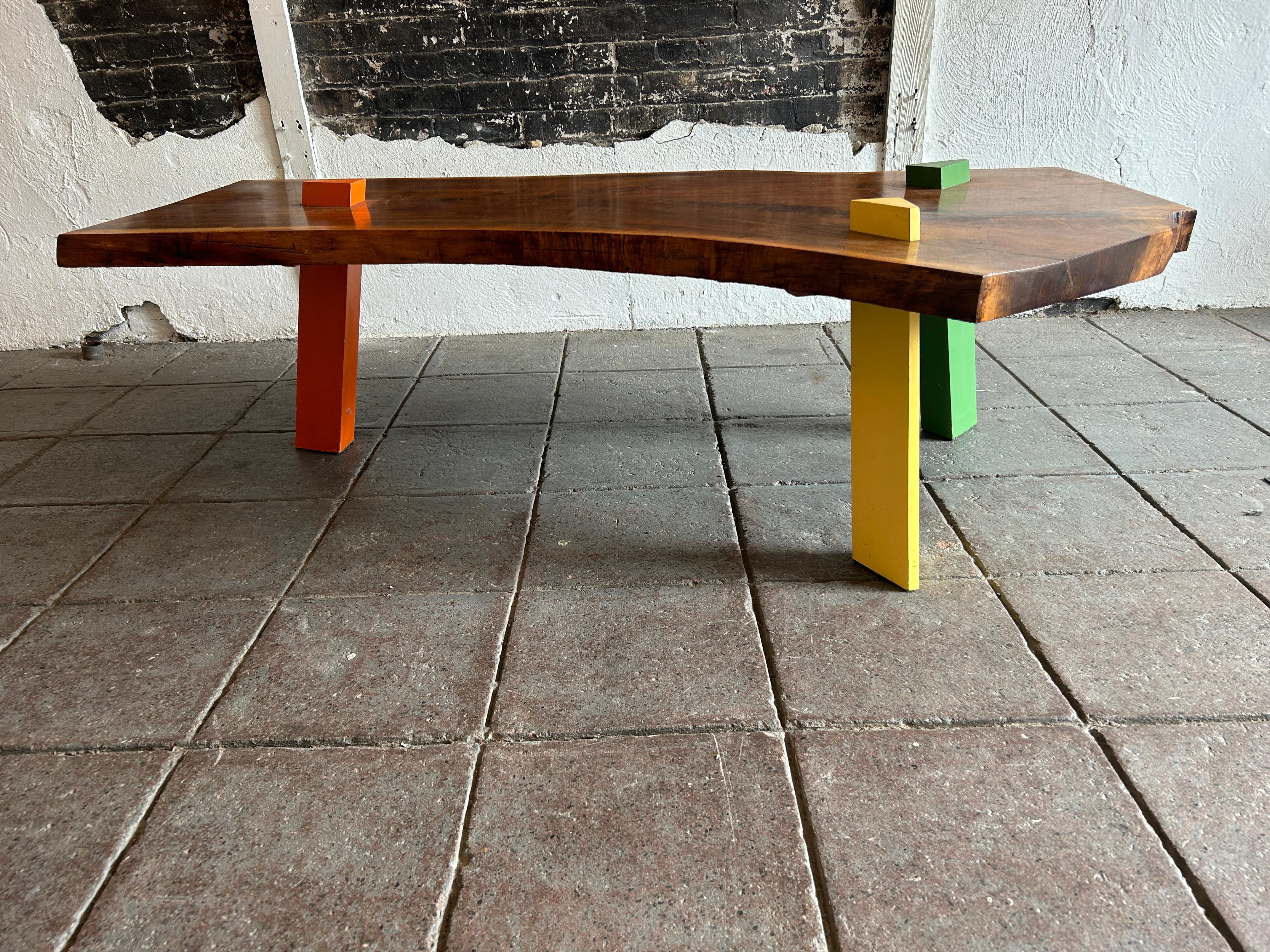Post Modern Walnut Slab coffee table with colored triangle legs studio craft For Sale 3