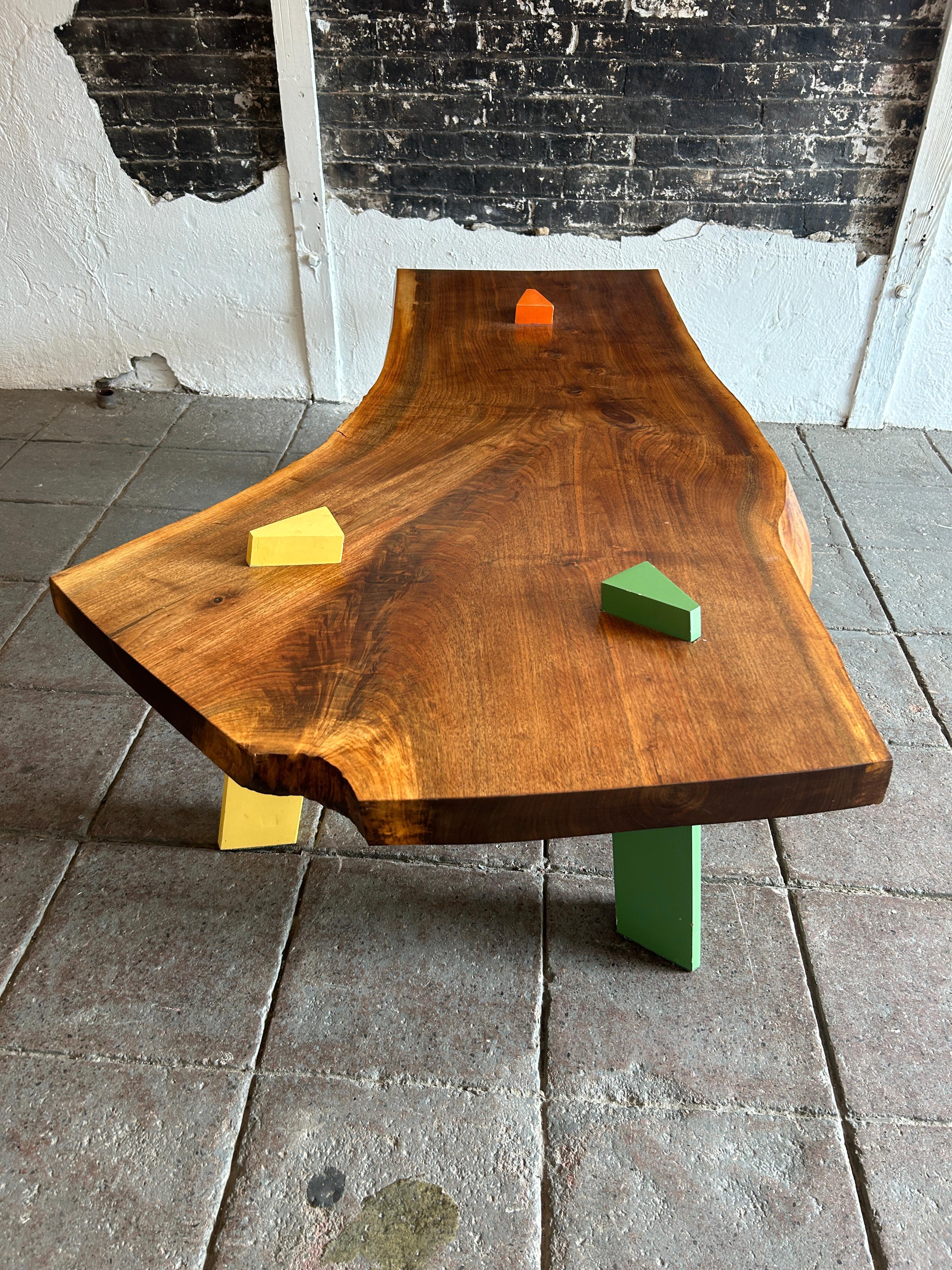 Late 20th Century Post Modern Walnut Slab coffee table with colored triangle legs studio craft  For Sale