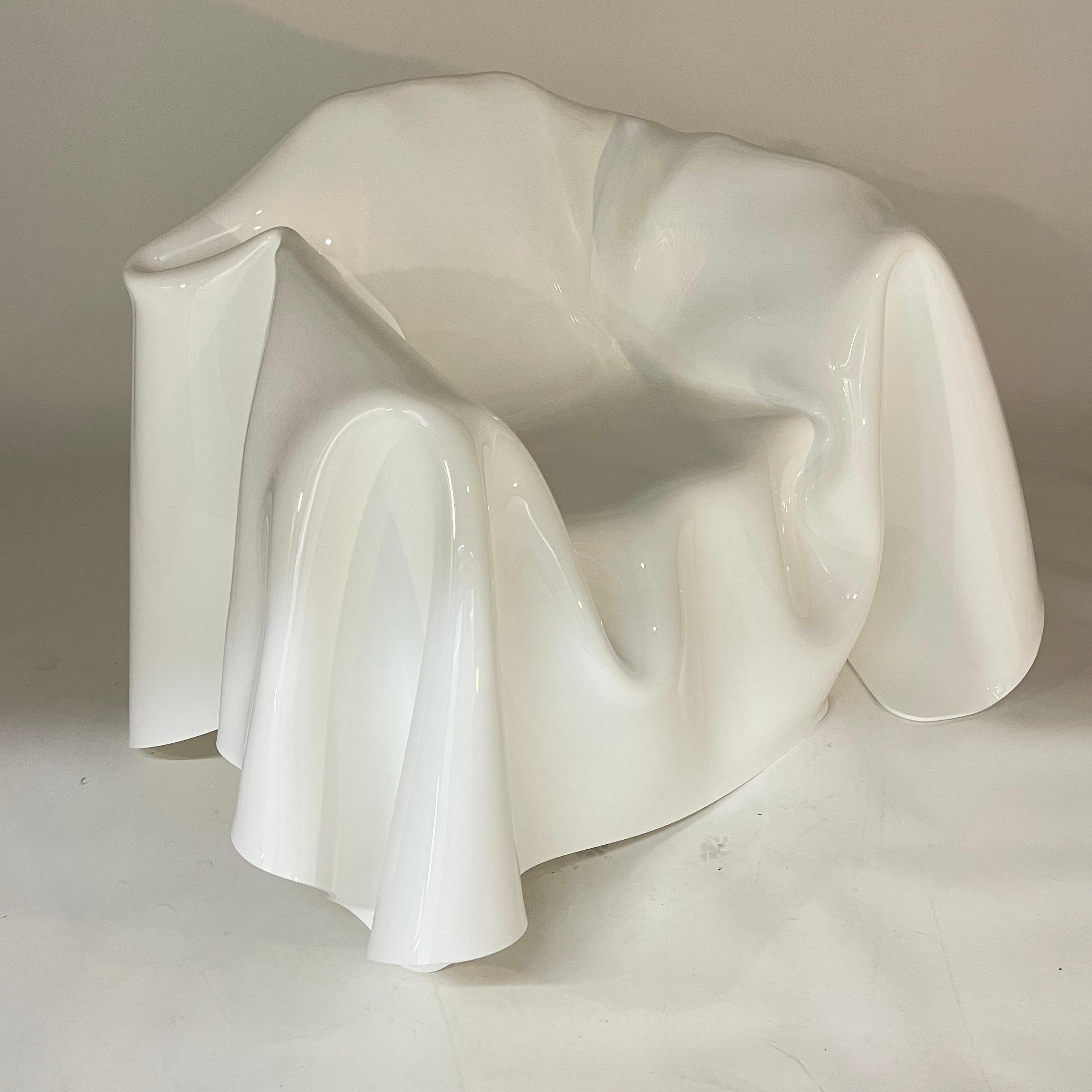 Stunning Postmodern surrealist floating lounge or club chair in the form a trompe l'oeil draped handkerchief with a shape very reminiscent of the Molar chair by Wendell Castle .  Rendered in white molded acrylic lucite, Italy, 1980s. 