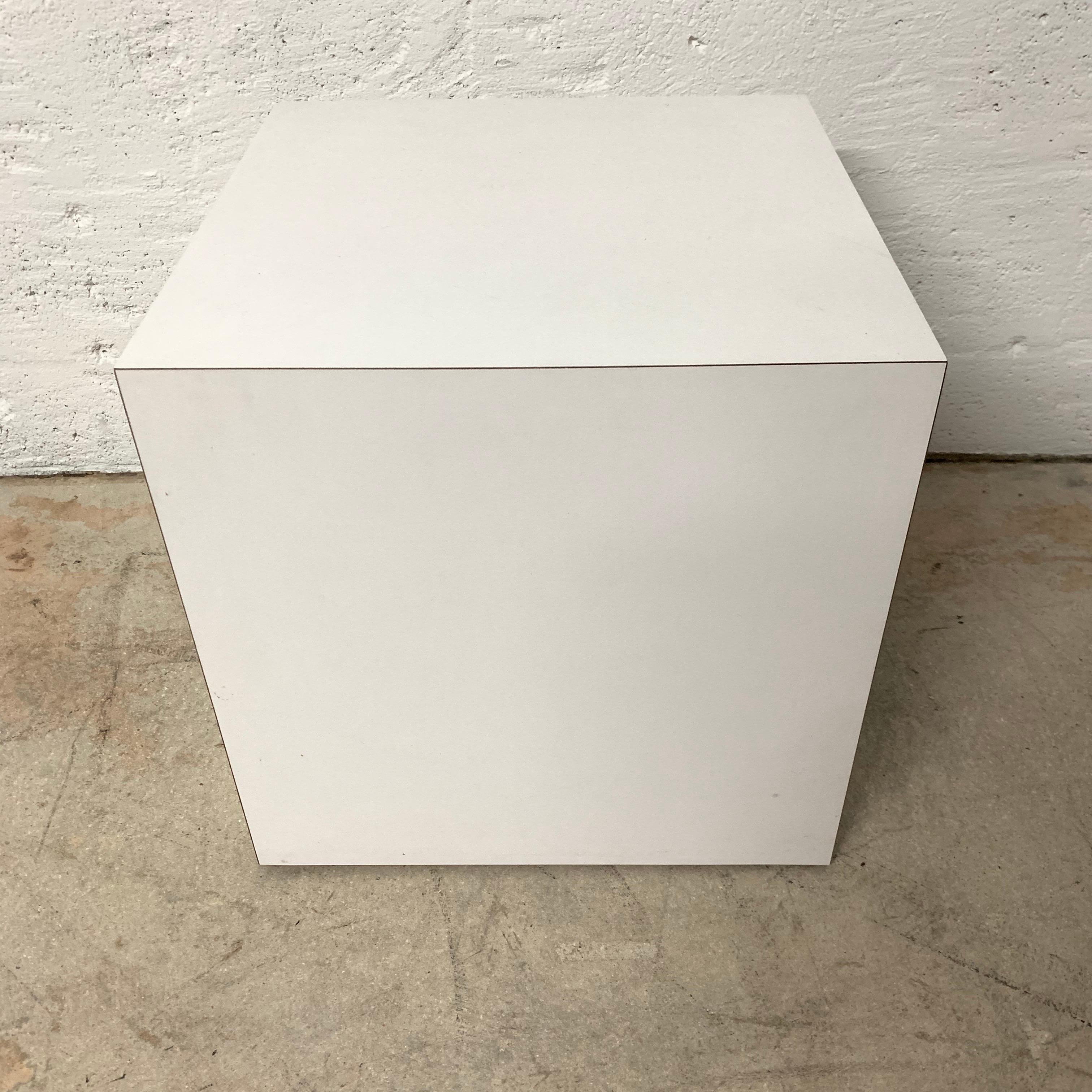 Postmodern cube table rendered in white laminate.