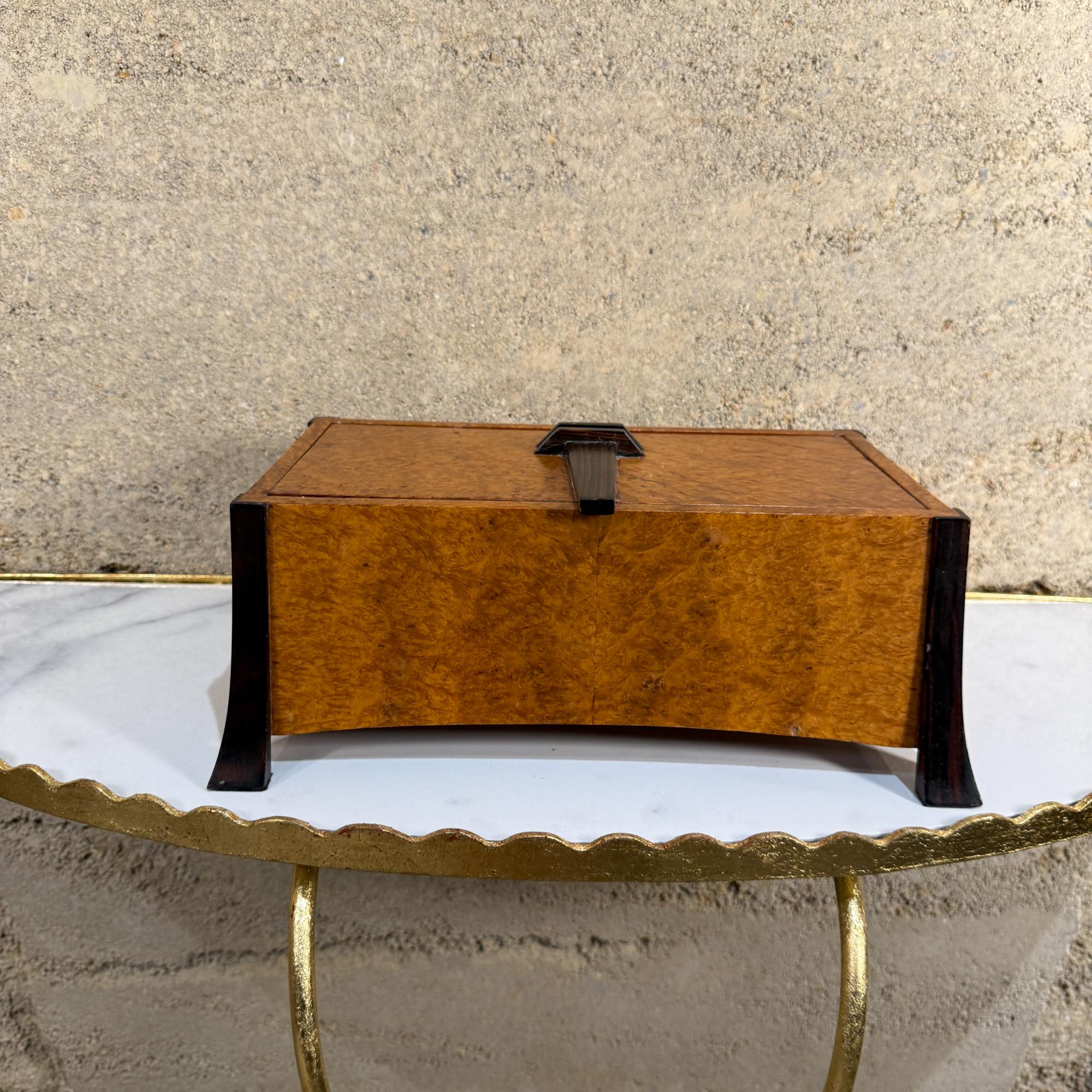 For your consideration, a post-modern jewelry box. Mahogany, ebony and burl wood  were used in this master piece of woodworking studio piece.

Dimensions: 4.5 H x 11 H x 6 D

Please visit take a look at our listings, we have an amazing curated