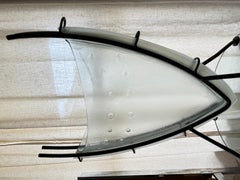 Post modern wrought iron plant stand with thick glass vase. Very heavy.