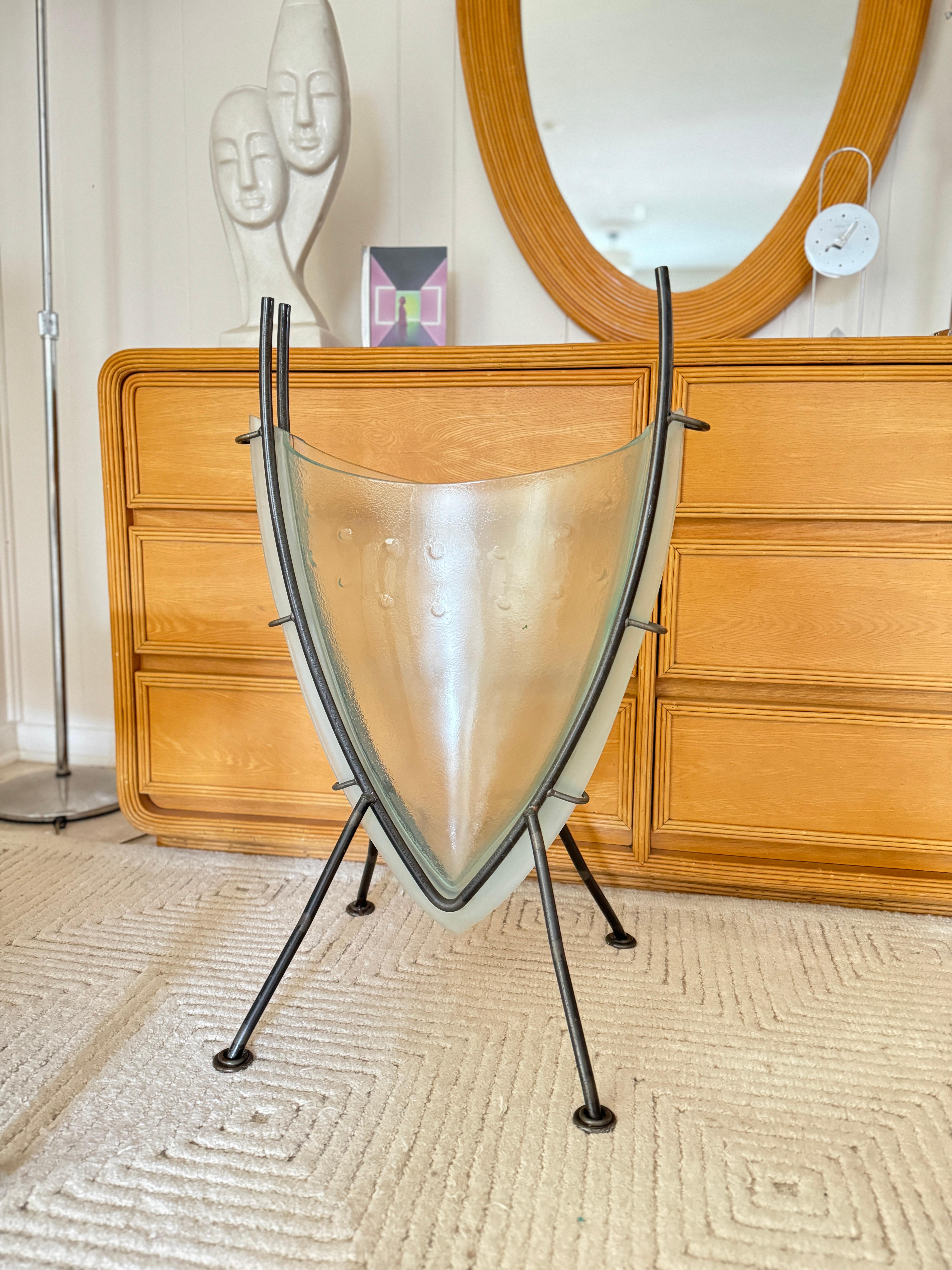 Post modern wrought iron plant stand with thick glass vase. Very heavy.  2