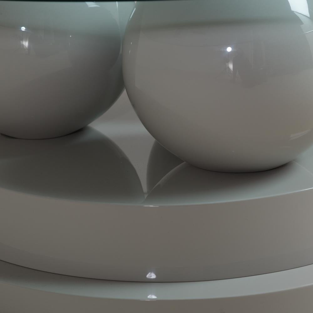 A sculptural post modernist grey lacquered coffee table comprising of three lacquered spheres on a stepped base 1980s
Base measurements provided, 
Stock glass included in price- size to be confirmed upon purchase.