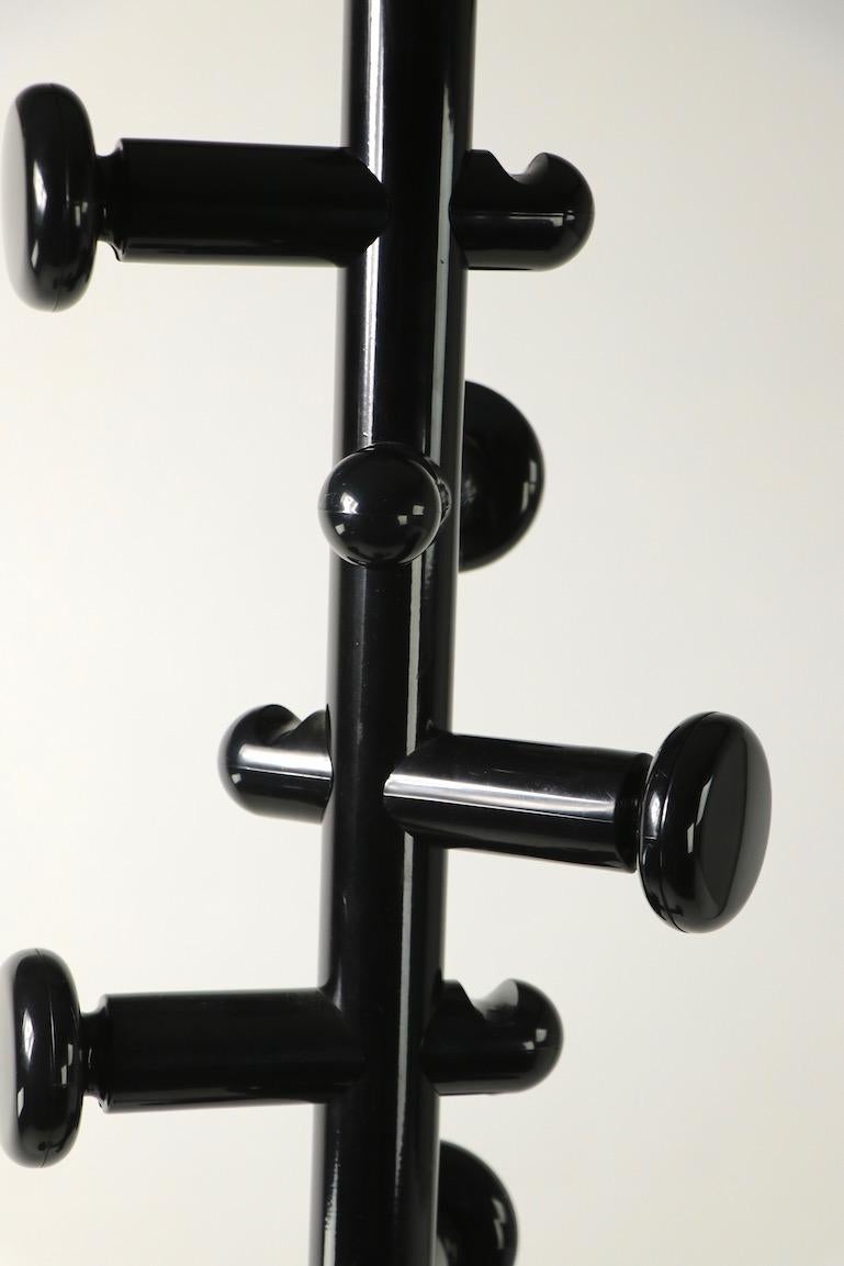 Post Modern coat tree stand in high glass black finish ( base is matt finish ), having six hooks for coats, scarves and hats. Sturdy, stable and well made, clean and ready to use. We believe the coat stand is Italian made, it is unsigned.