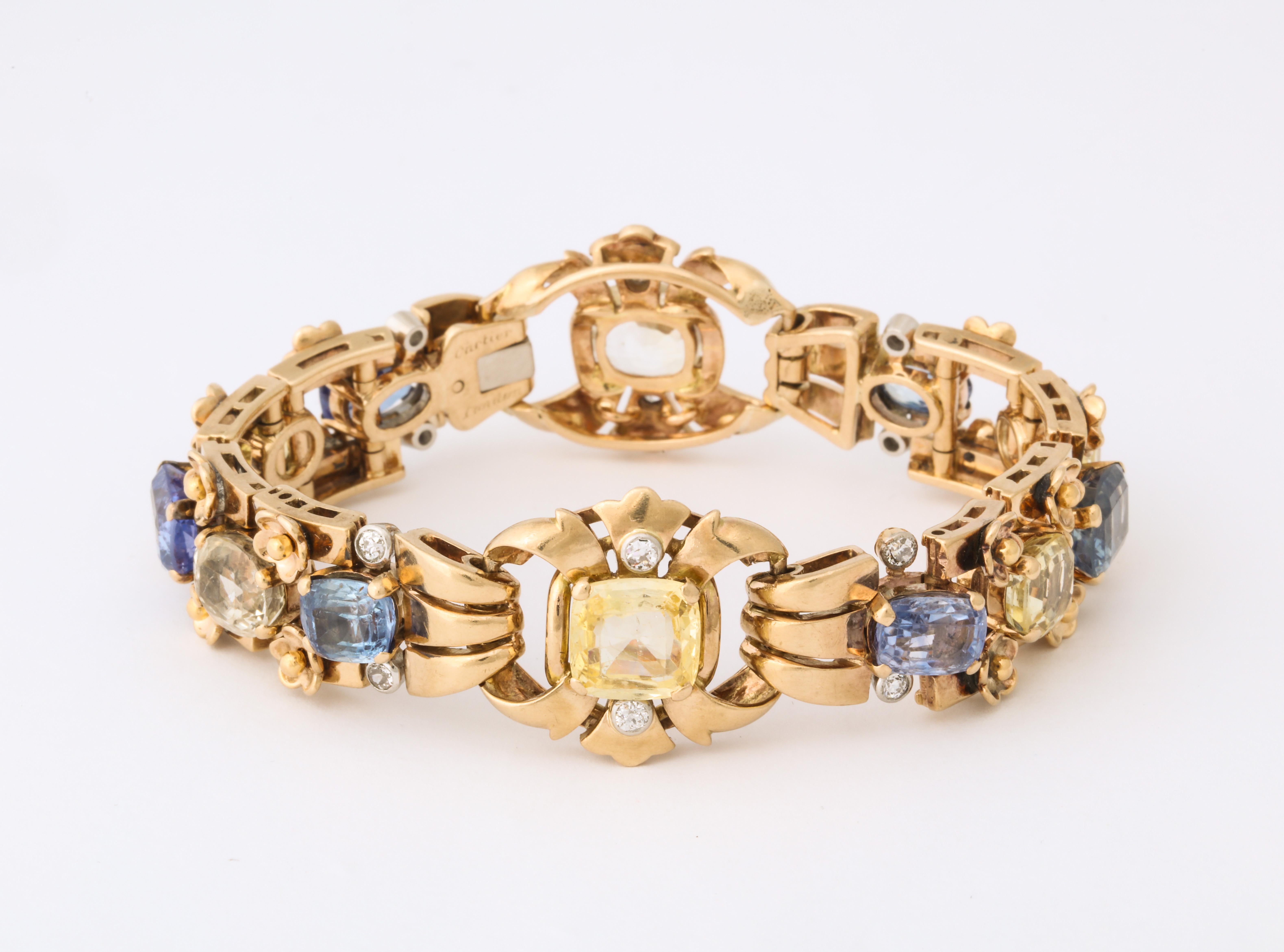 Pastel blue and yellow cushion cut sapphires are alternately set and highlighted with diamonds in this elegant vintage Cartier bracelet.  Made by 