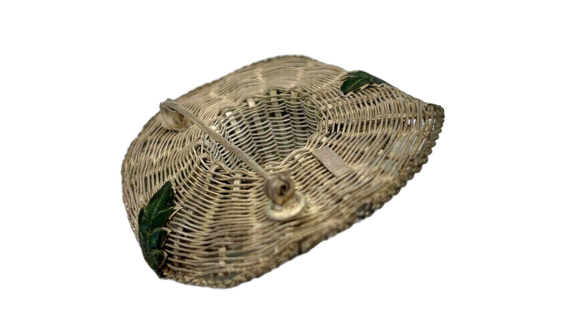 Original 1950s Export Chinese Silver Filigree Enamel women's wide brim sun hat Brooch features a delicate filigree pattern crafted from woven silver filigree. The enamel work adds vibrant colors to the piece, creating a striking contrast with the