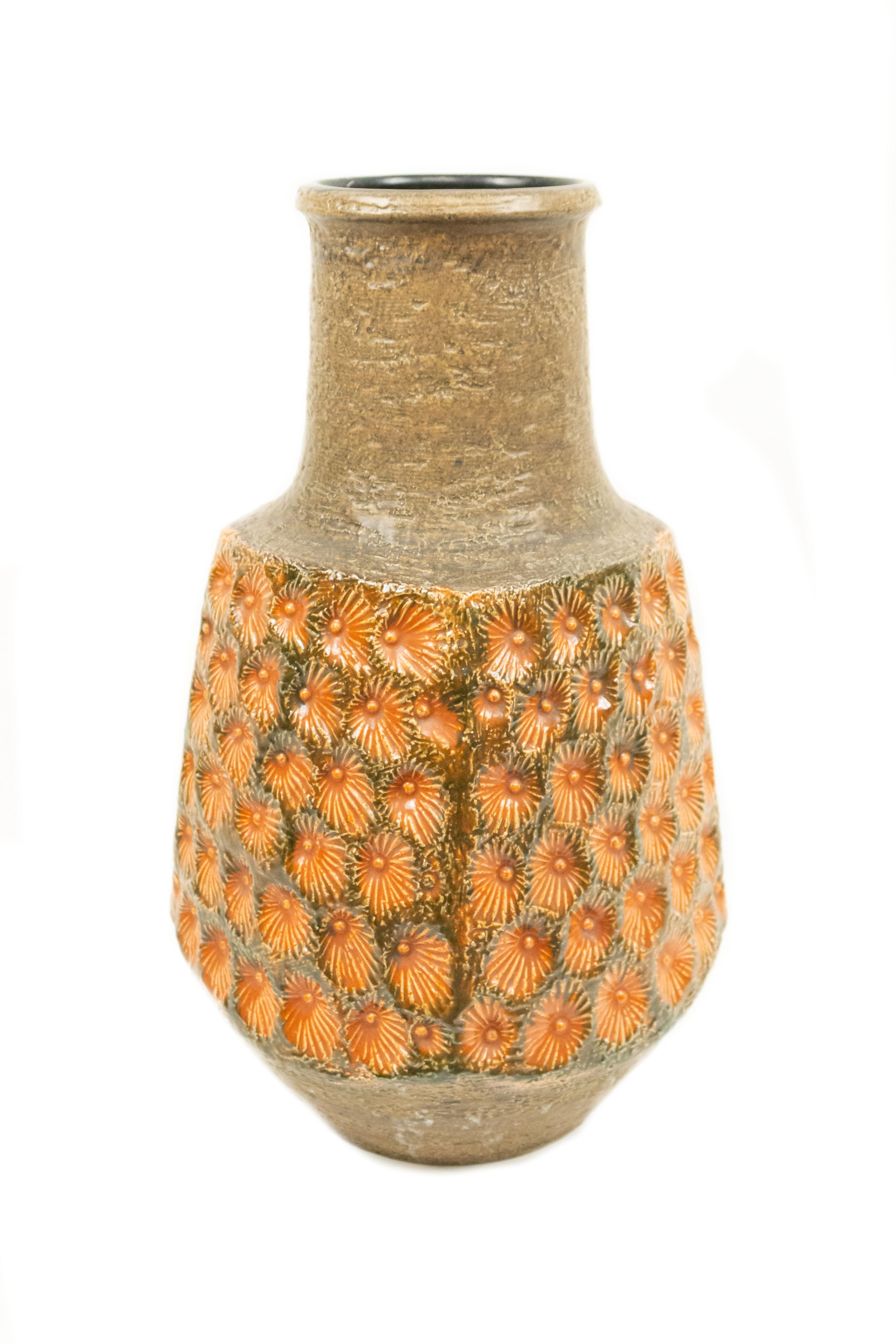 Post-War West Germany olive green ceramic vase with an orange incised centered multiple shell form pattern (JASBA).
      