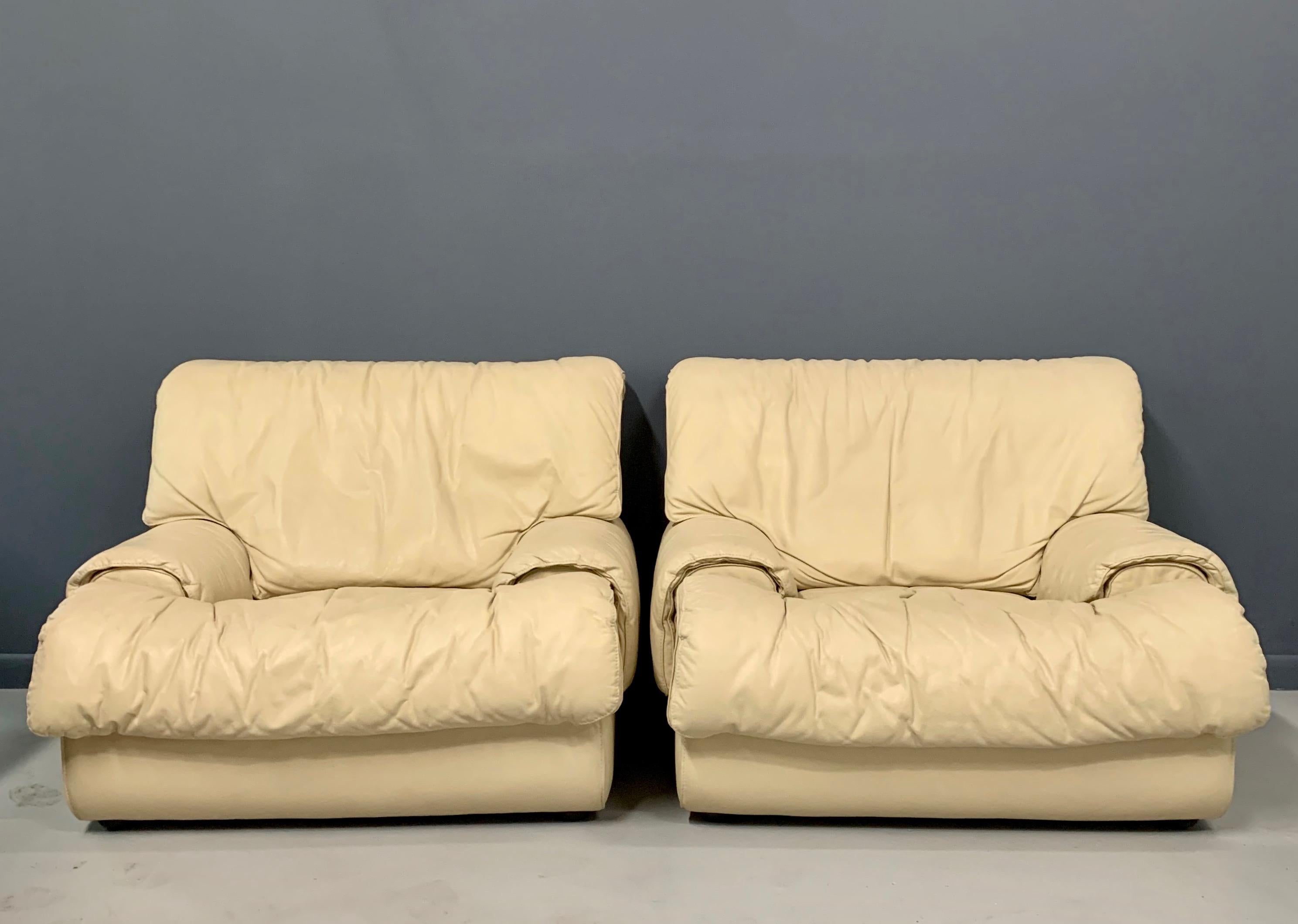 These oversized lounge chairs and ottomans by Roche Bobois created in the 1980s are upholstered in luxuriously soft leather that is in beautiful condition.