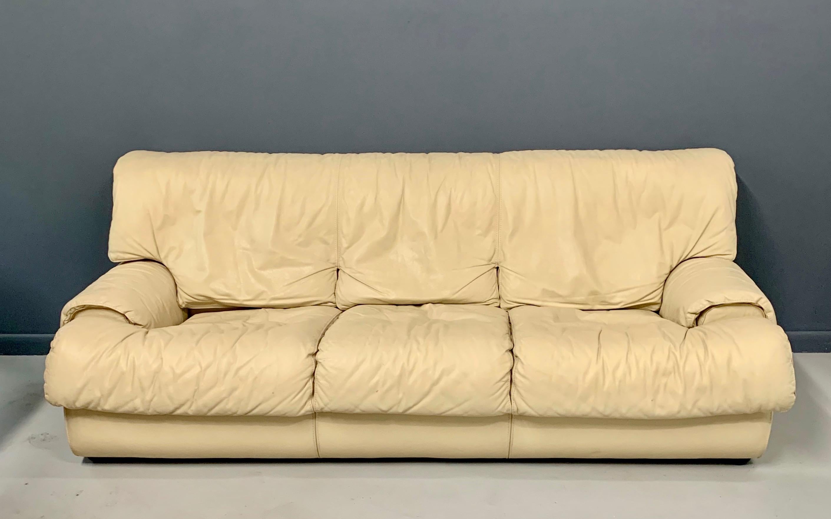Wonderfully comfortable sofa, surrounds you in a softly draped fawn colored leather.