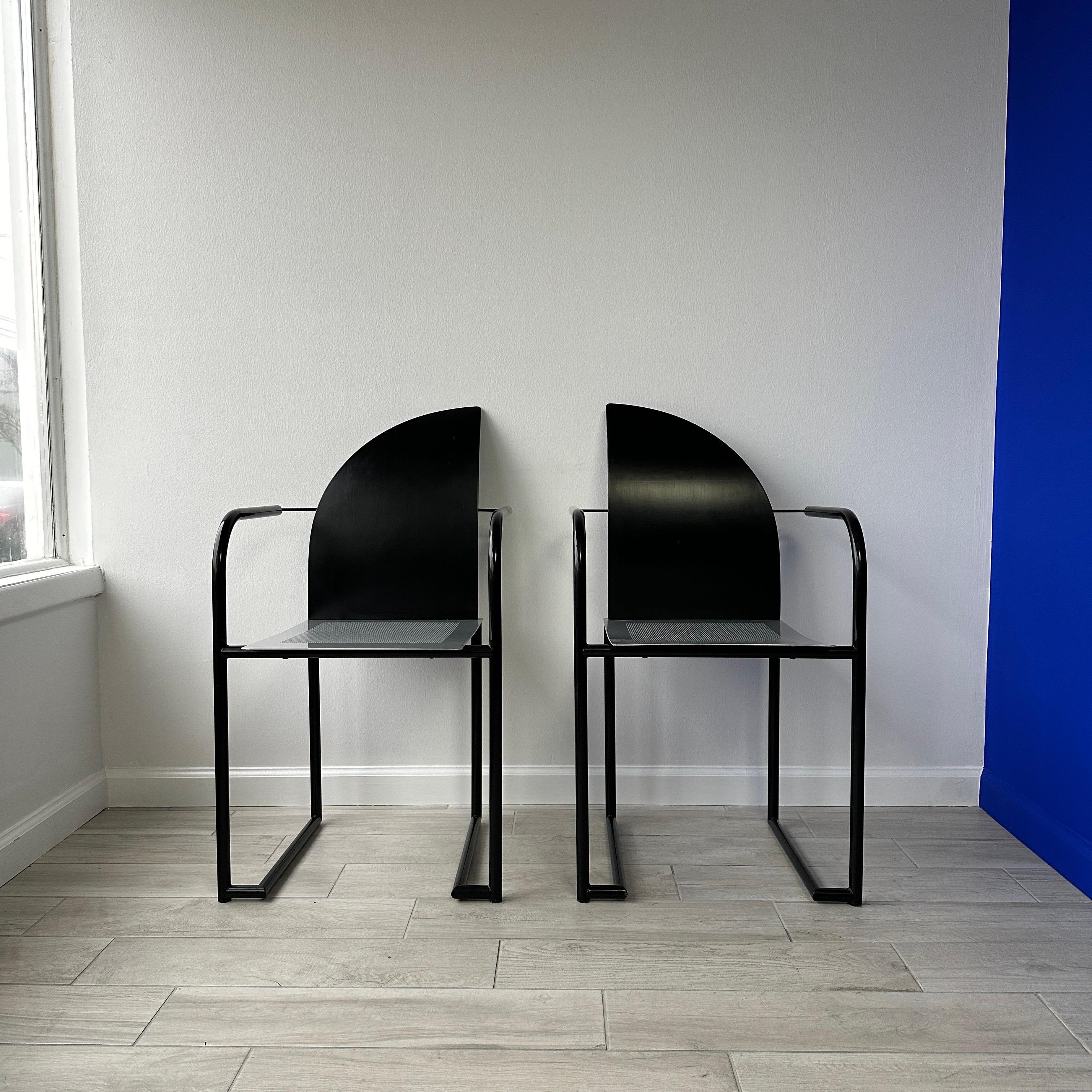 Vintage circa 1980s postmodern side chairs. Made of perforated metal seat with black metal tubing and a curved wood back. In the style of Karl Friedrich Förster 'KFF' or Mario Botta. Originally purchased for a loft space in the 1980s and a rare