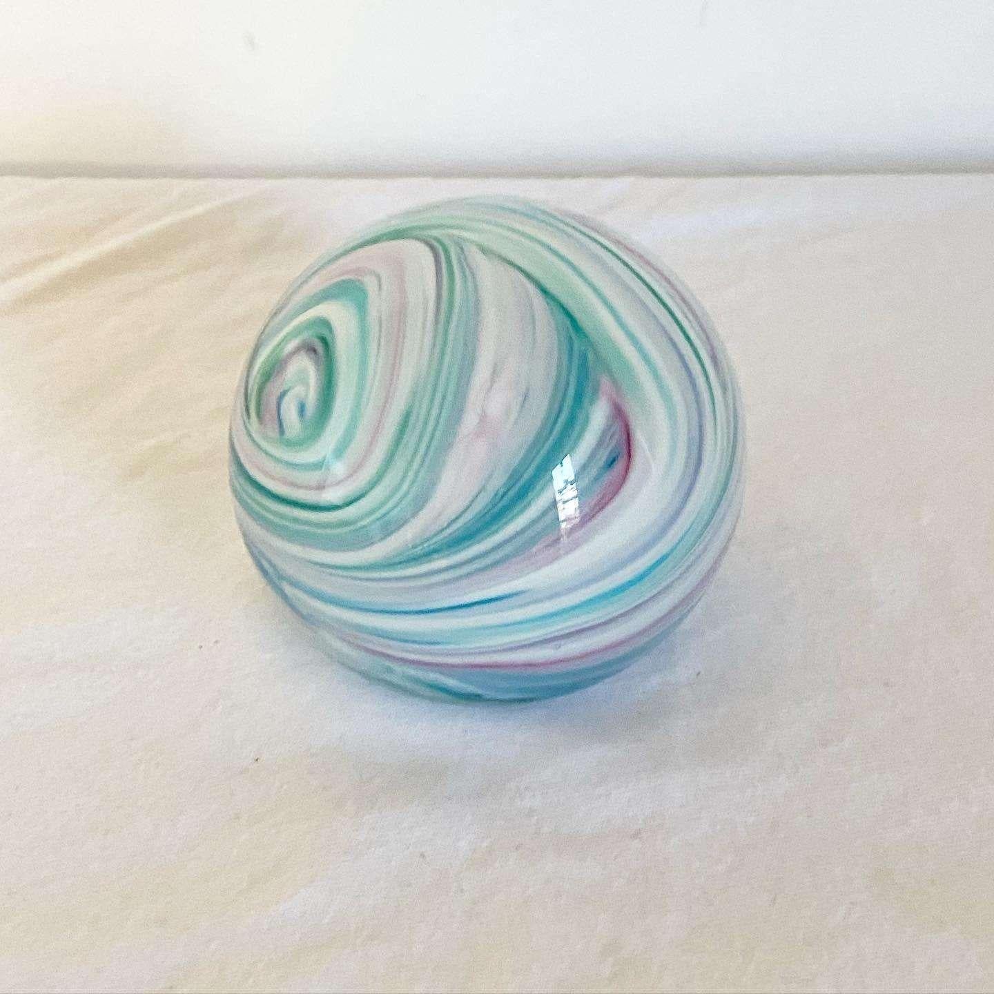 Exceptional vintage Postmodern paper weight. Features a blue swirl.
