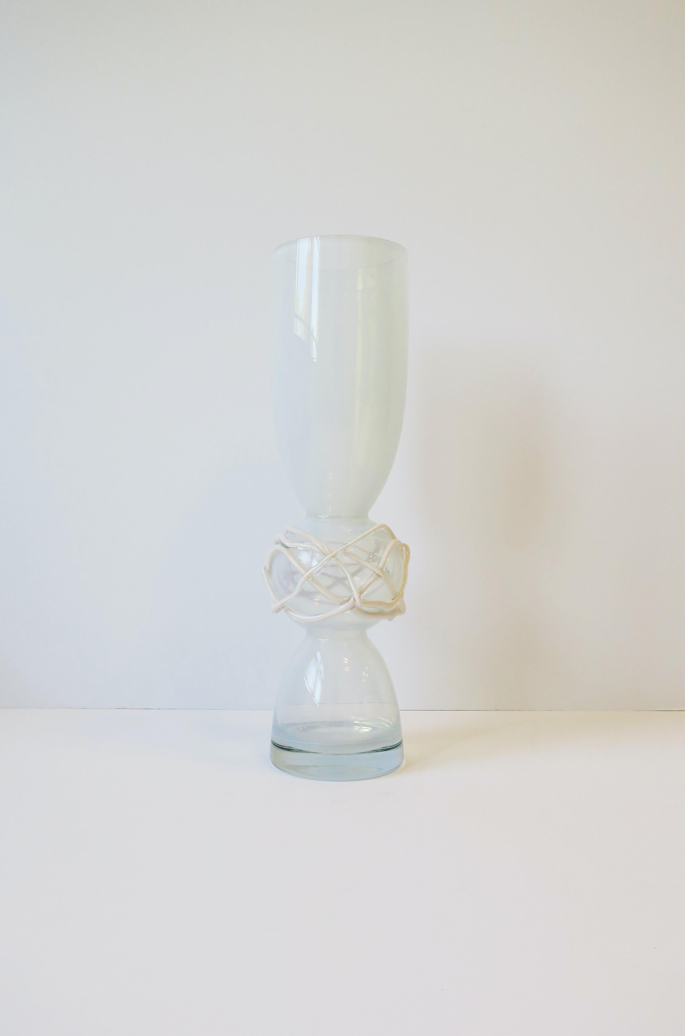 A beautiful, tall and substantial Post-Modern abstract art glass vase that's clear and white opaline glass with a slight iridescence, circa late-20th century. Center 'ball' area has an abstract design of clear and twisted white art glass.