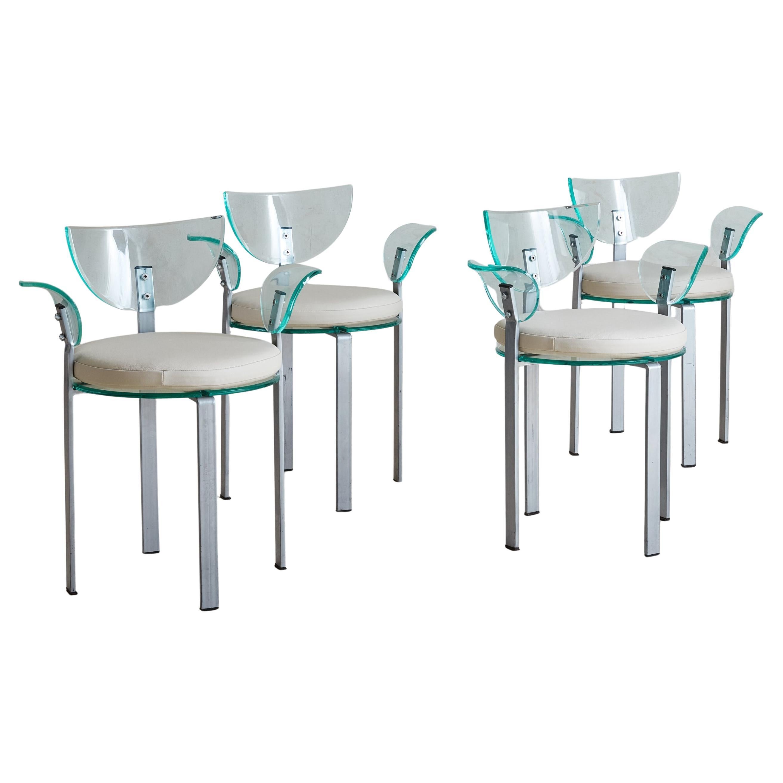 A 1980s Postmodern dining or accent chair featuring a sculptural acrylic back and armrests, each in a subtle aqua hue. The curved forms of the acrylic elements contrast beautifully with the minimalist lines of the metal legs, creating a harmonious