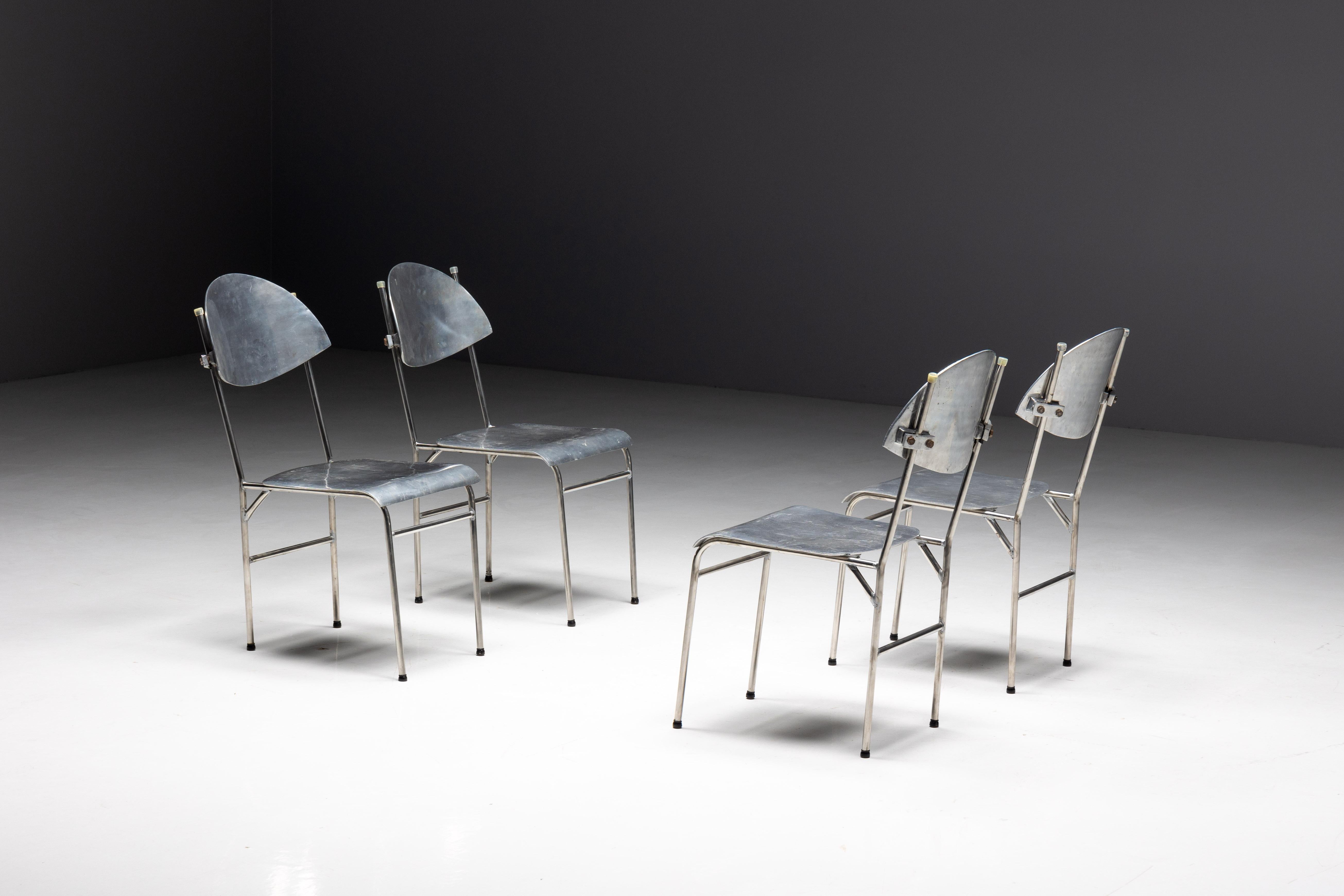 Aluminum postmodern dining chairs made in the 1980s from lightweight but durable aluminum. These chairs have clean lines and geometric shapes that reflect the simplicity of modern design. However, it is the playful details that really set them
