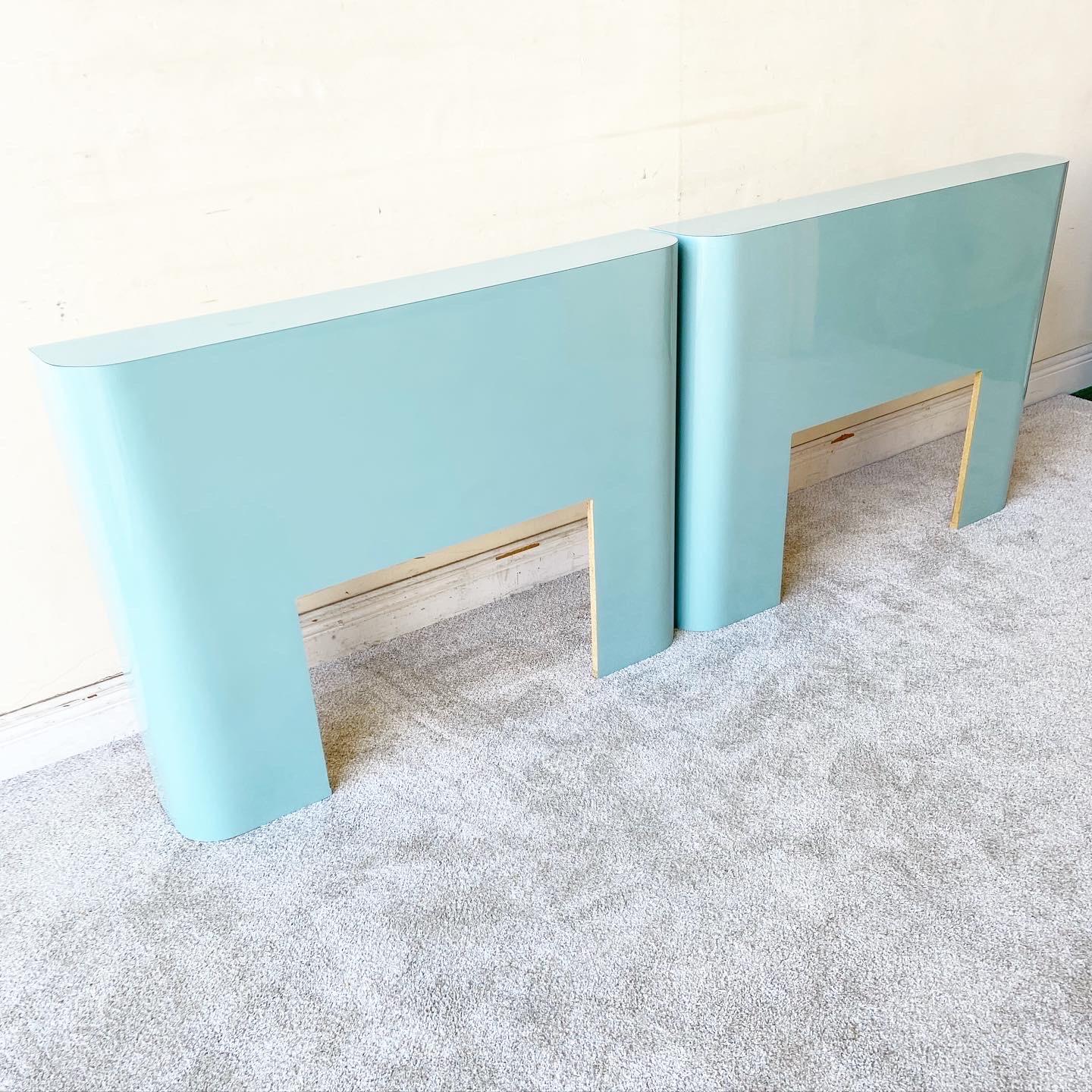 Exceptional pair of 1980s vintage postmodern twin size headboard. Each feature an aqua blue lacquer laminate. Can be put together as a king size.