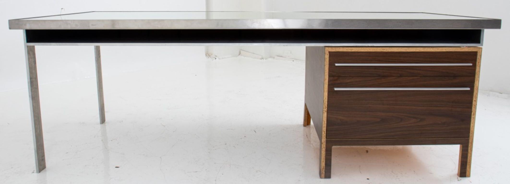 Postmodern Large Architect-Designed Plywood and Steel Custom-Made Desk, the heavy mirrored steel-framed top and supporting legs cut from flat panel steel, with recessed chipboard inset, the right return supported by a cut veneered plywood side
