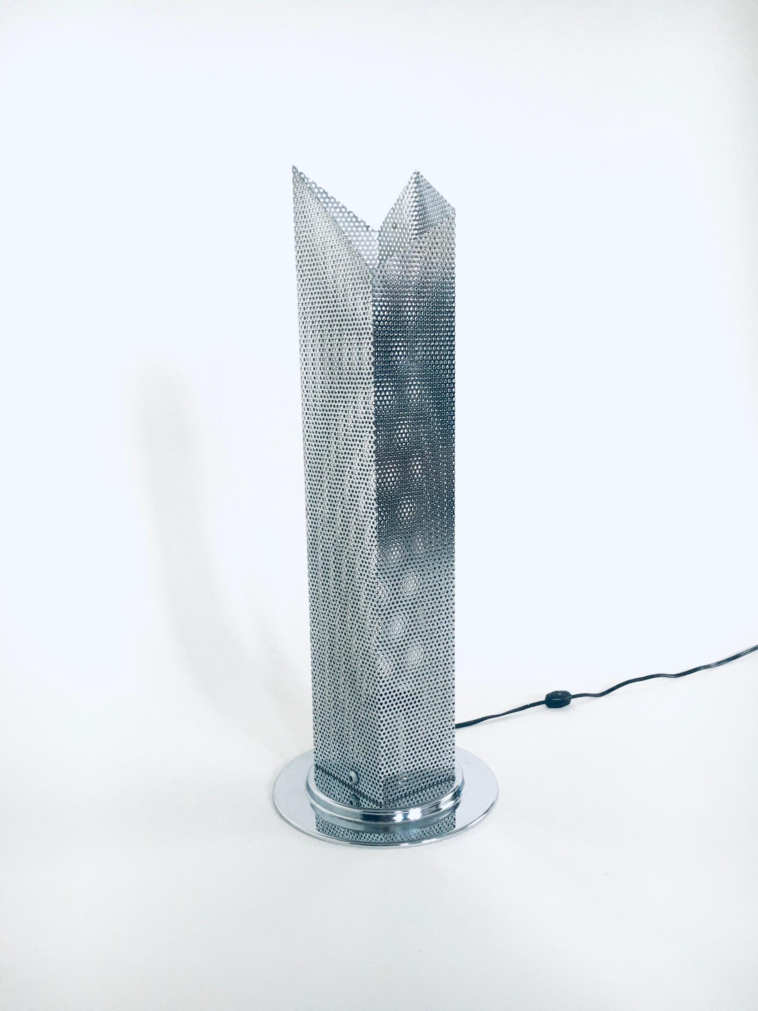 Vintage Postmodern Italian Design chrome steel perforated metal table lamp for IKEA, made in Italy 1980's. Architectural design table or floor lamp in perforated machine made steel metal folded sheets on round chrome metal base. Sky Scraper