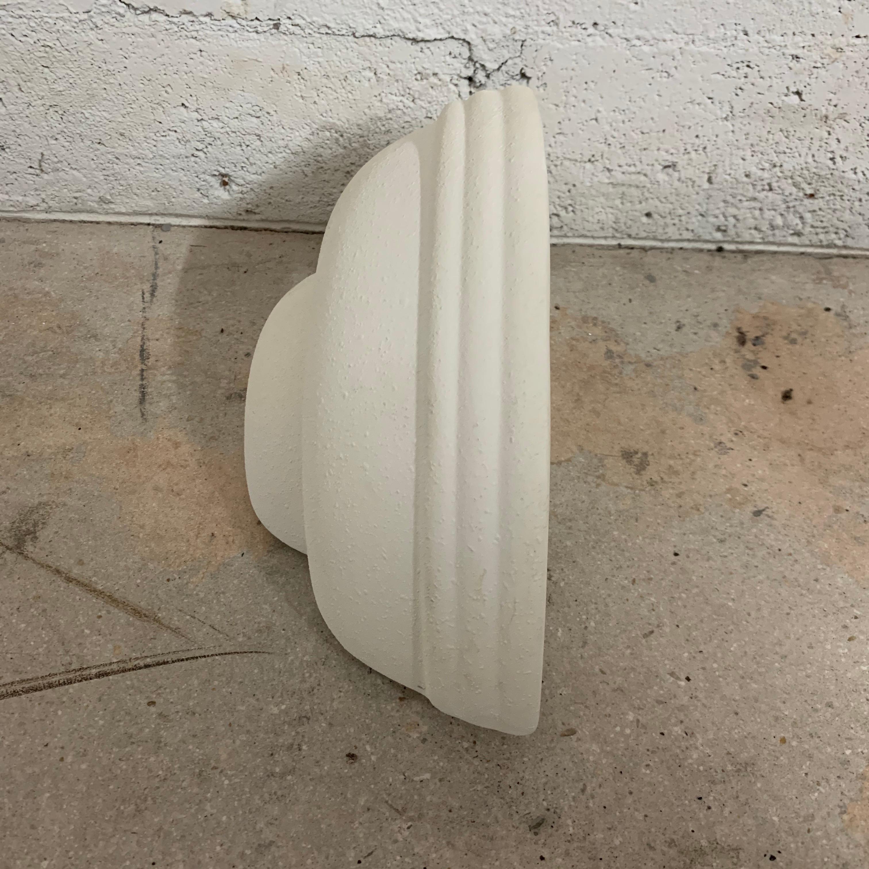 Postmodern uplighter or down light wall sconce in the Art Deco revival style rendered in white Matt glazed ceramic with a natural textural finish.