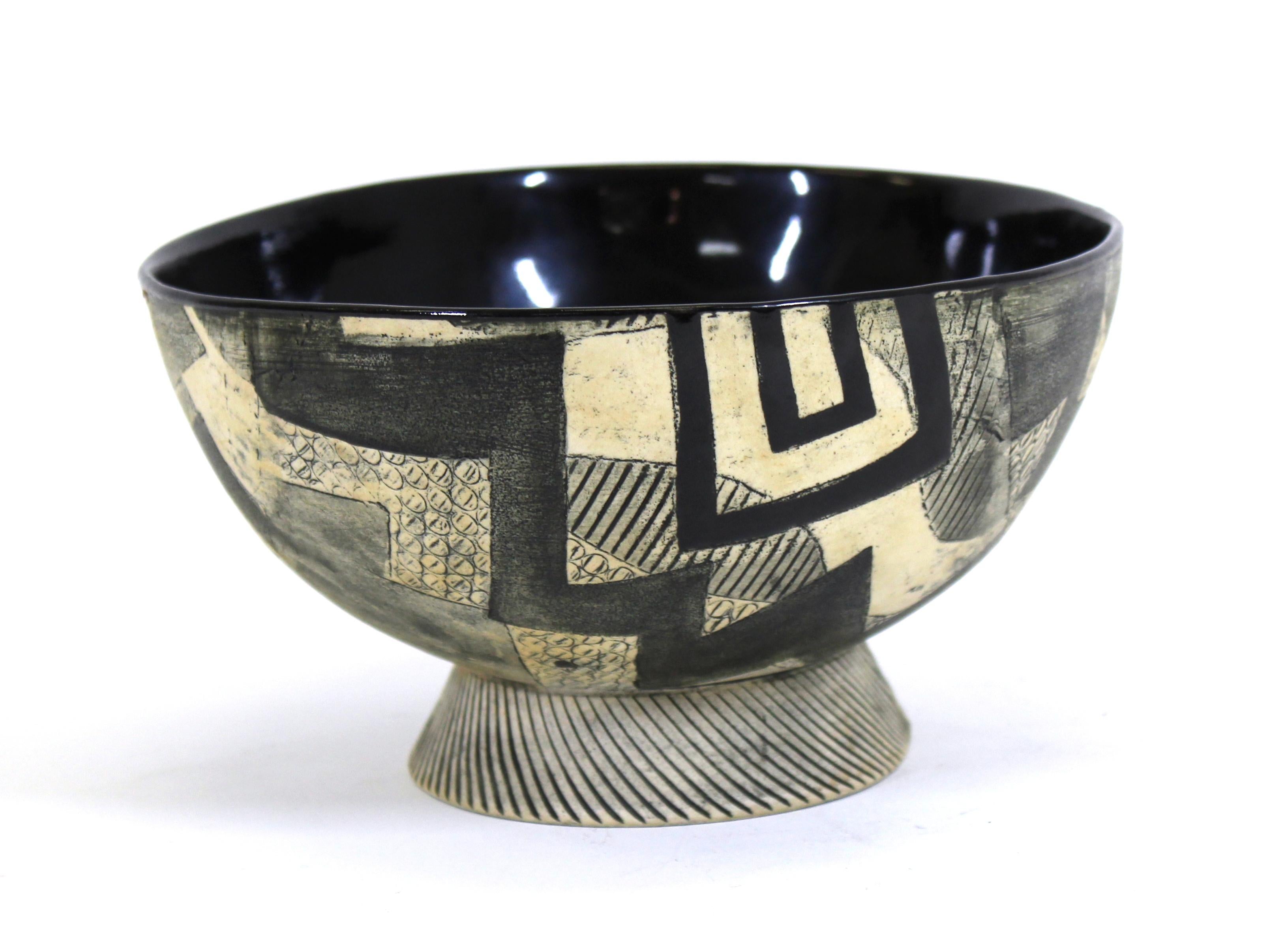 Postmodern art studio ceramic bowl with bold geometric pattern, stamped 'Ash' and dated 1989 on bottom.