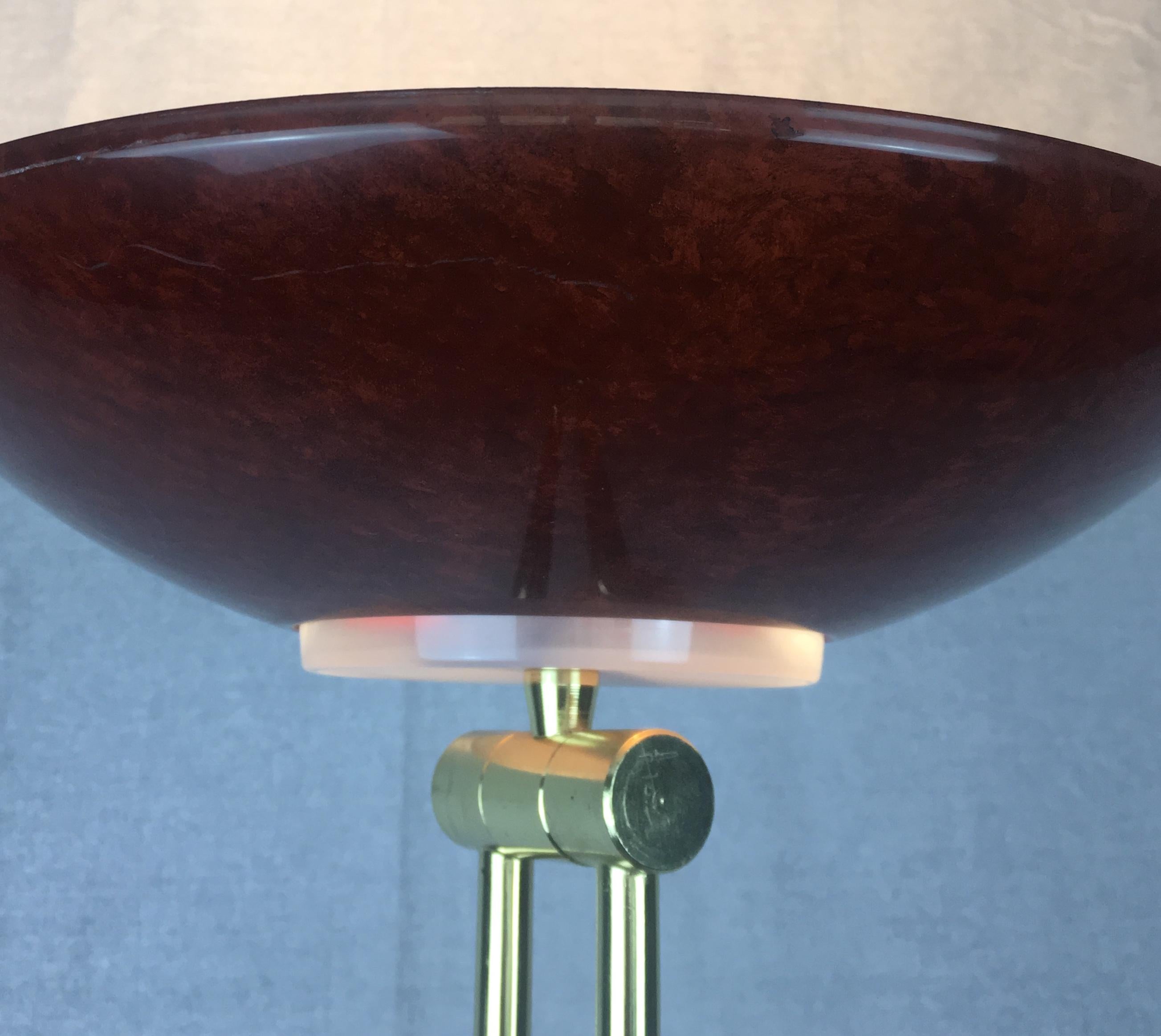 Striking postmodern articulated floor lamp, circa 1980s-1990s. This stunning French artisan crafted sculptural metal standing lamp is accented with brass fittings and designed with articulating joints, allowing for directional lighting.

Various