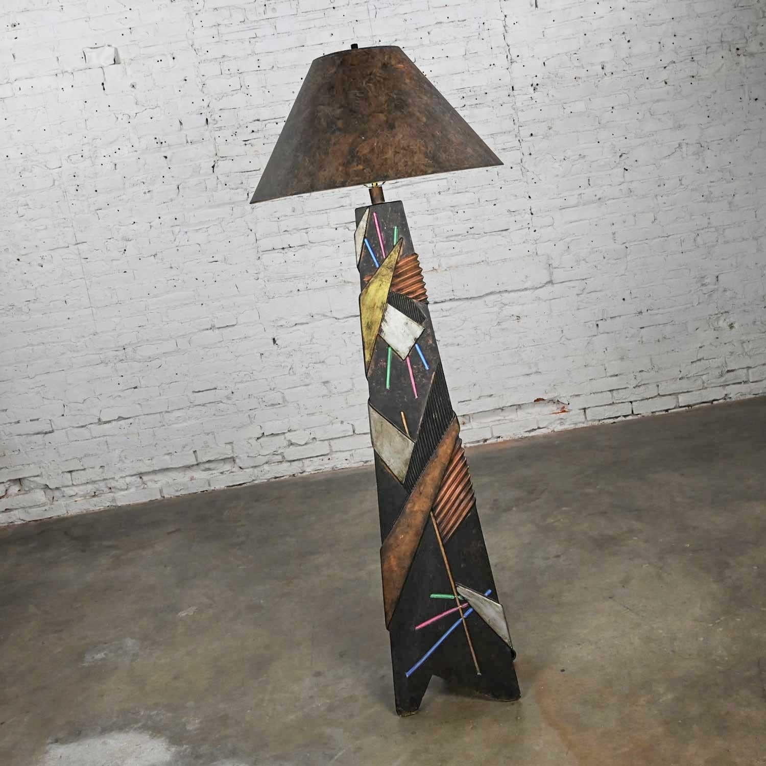 Awesome postmodern Artmaster Studios geometric triangular hand painted plaster floor lamp. Beautiful condition, keeping in mind that this is vintage and not new so will have signs of use and wear. We found a couple chips and dings in the plaster,