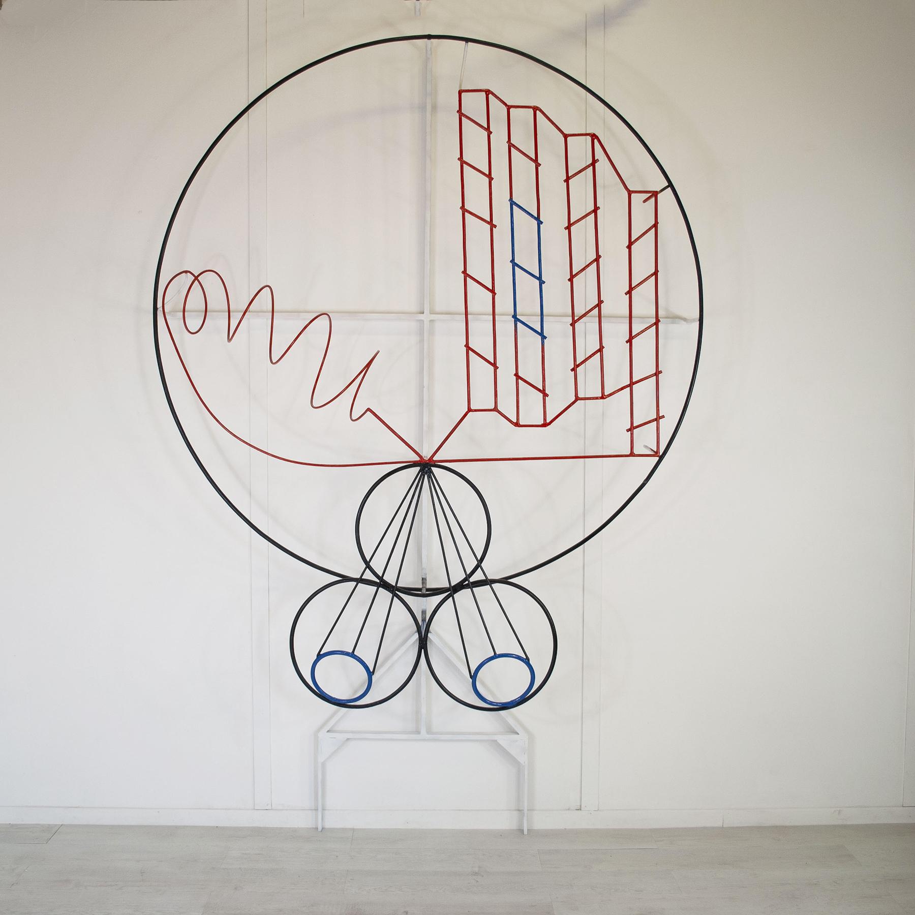 Postmodern wrought iron work “Intelligence creates culture” by Apulian sculptor painter Michelangelo Iacobellis from 1981.