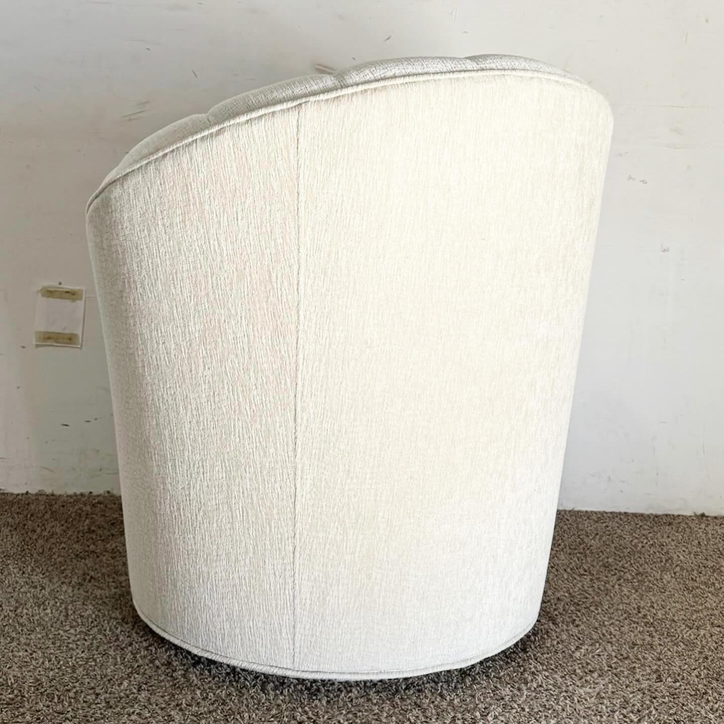 Embrace comfort and modern design with the Postmodern Ascending Clam Shell Back Swivel Chair with Nesting Foot Rest. This chair features a unique clam shell back, swivel base, and a convenient nesting footrest, blending style and functionality for
