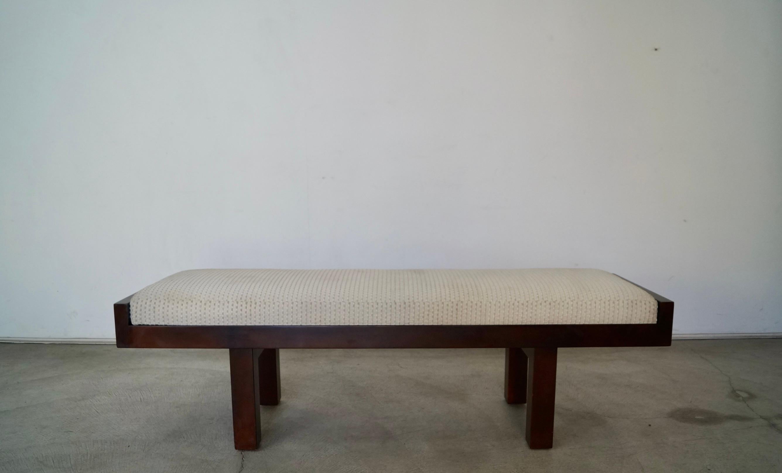 Vintage post-modern bench for sale. Manufactured by Baker Furniture in 2001, and designed by Coach and called the Mantattan bench. Has all the original tags, and the original finish. It has a solid wood frame in a Mid-century Modern style. The