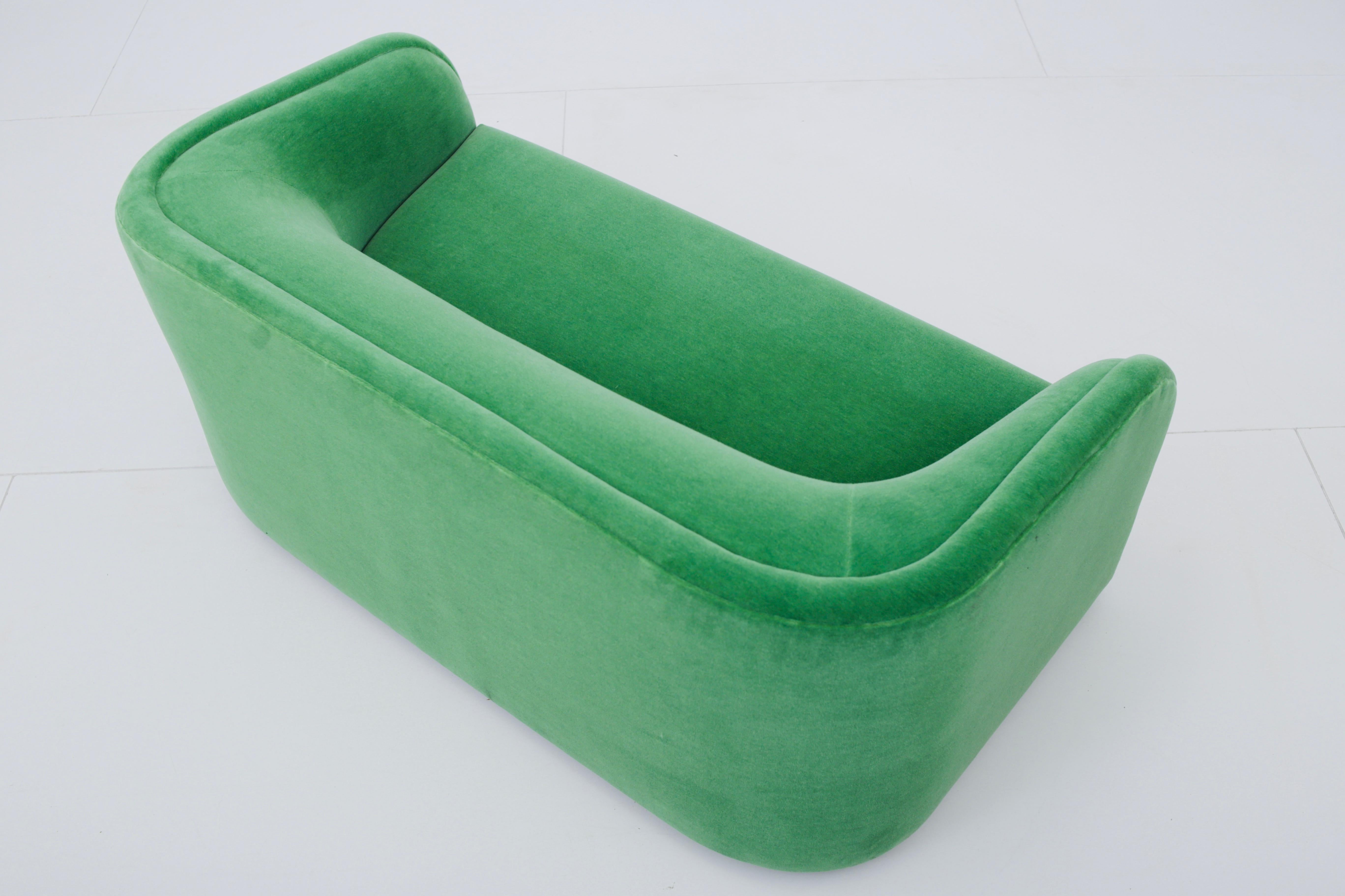 Fully restored 1980s Postmodern settee. Reupholstered in green mohair.