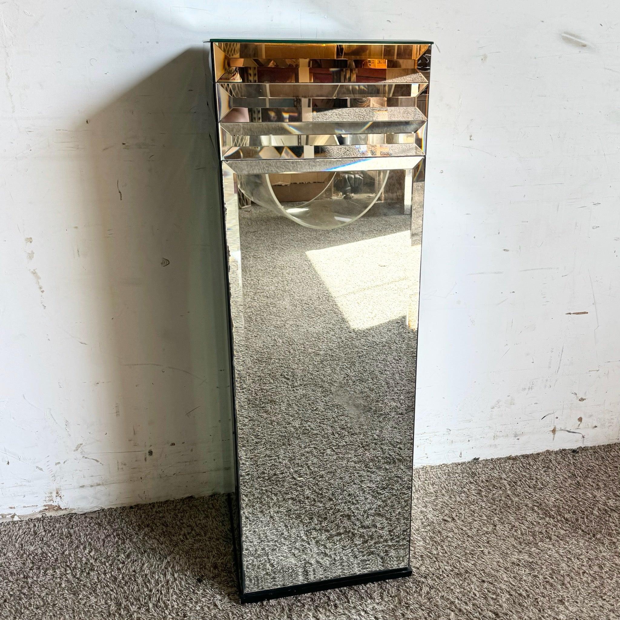 Postmodern Beveled Mirror Pedestal with sleek, reflective surfaces and elegant beveling, perfect for modern or eclectic display needs.
 
 Some pitting along the edges of the mirrors as shown in the photos.
 
 We sell items as acquired, without