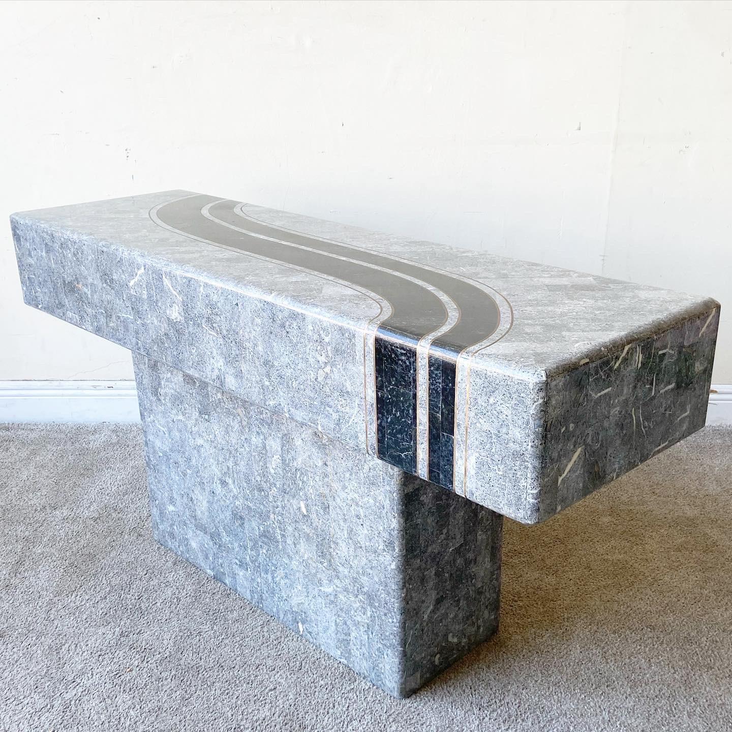 Exceptional postmodern tessellated stone console table. Features a polished black and grey stone.
 